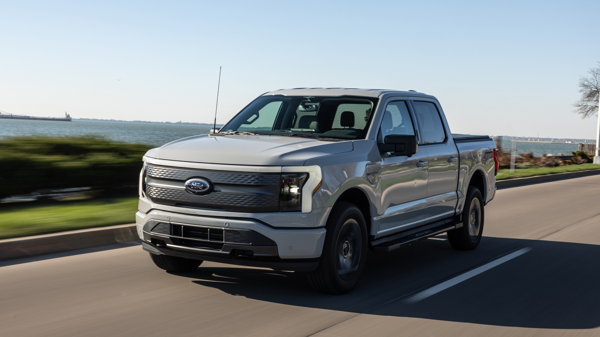 059 2023 Ford F 150 Lightning XLT front three quarters in action