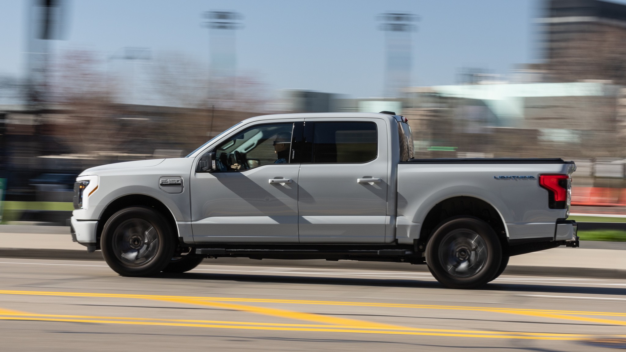 065 2023 Ford F 150 Lightning XLT side profile in action