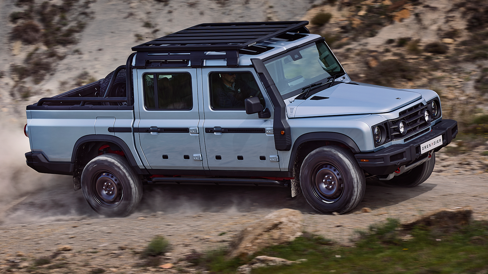 Ineos Grenadier Quartermaster off road pickup truck motion side 2