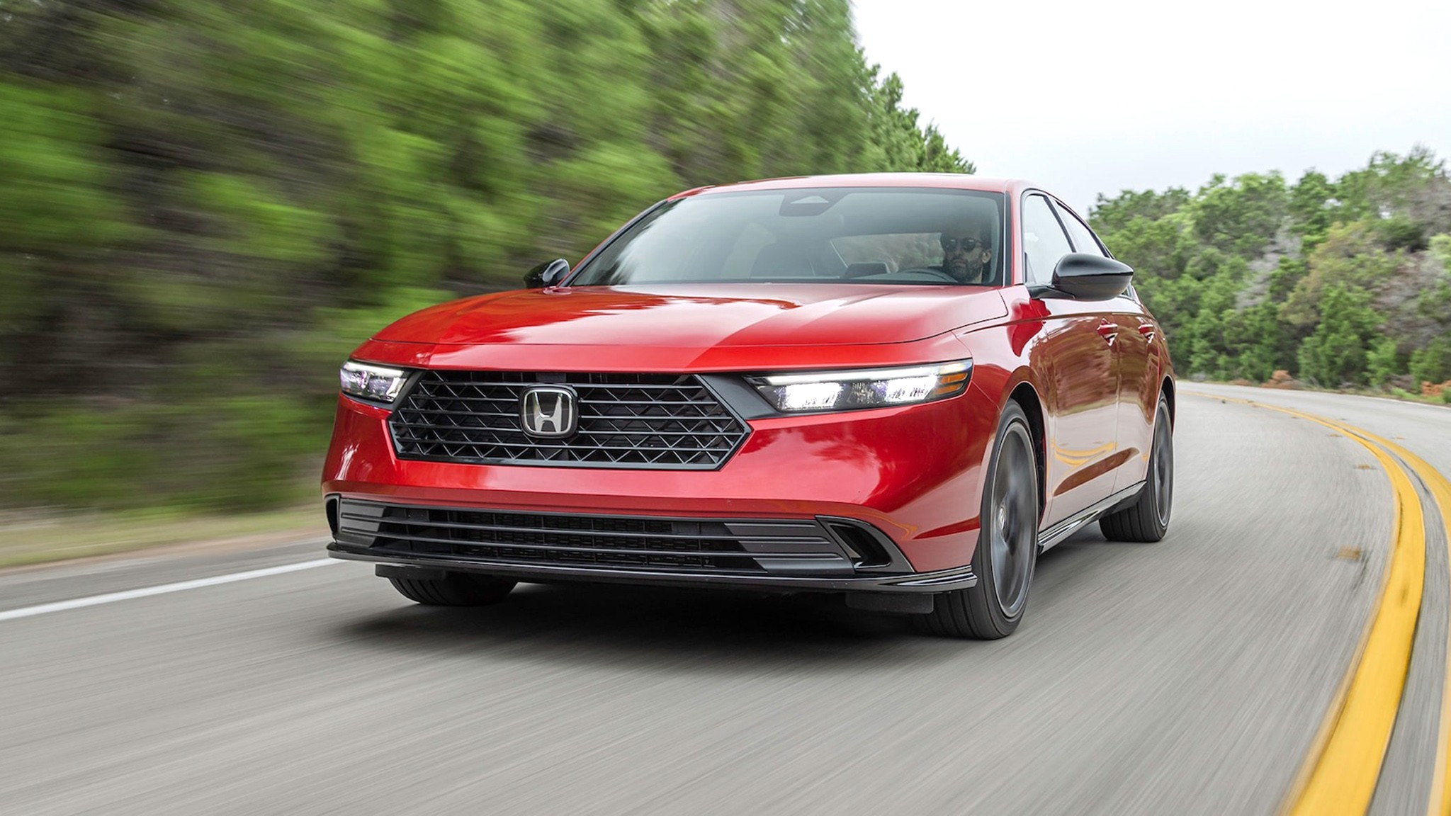 032 2024 Honda Accord Hybrid front three quarters in action