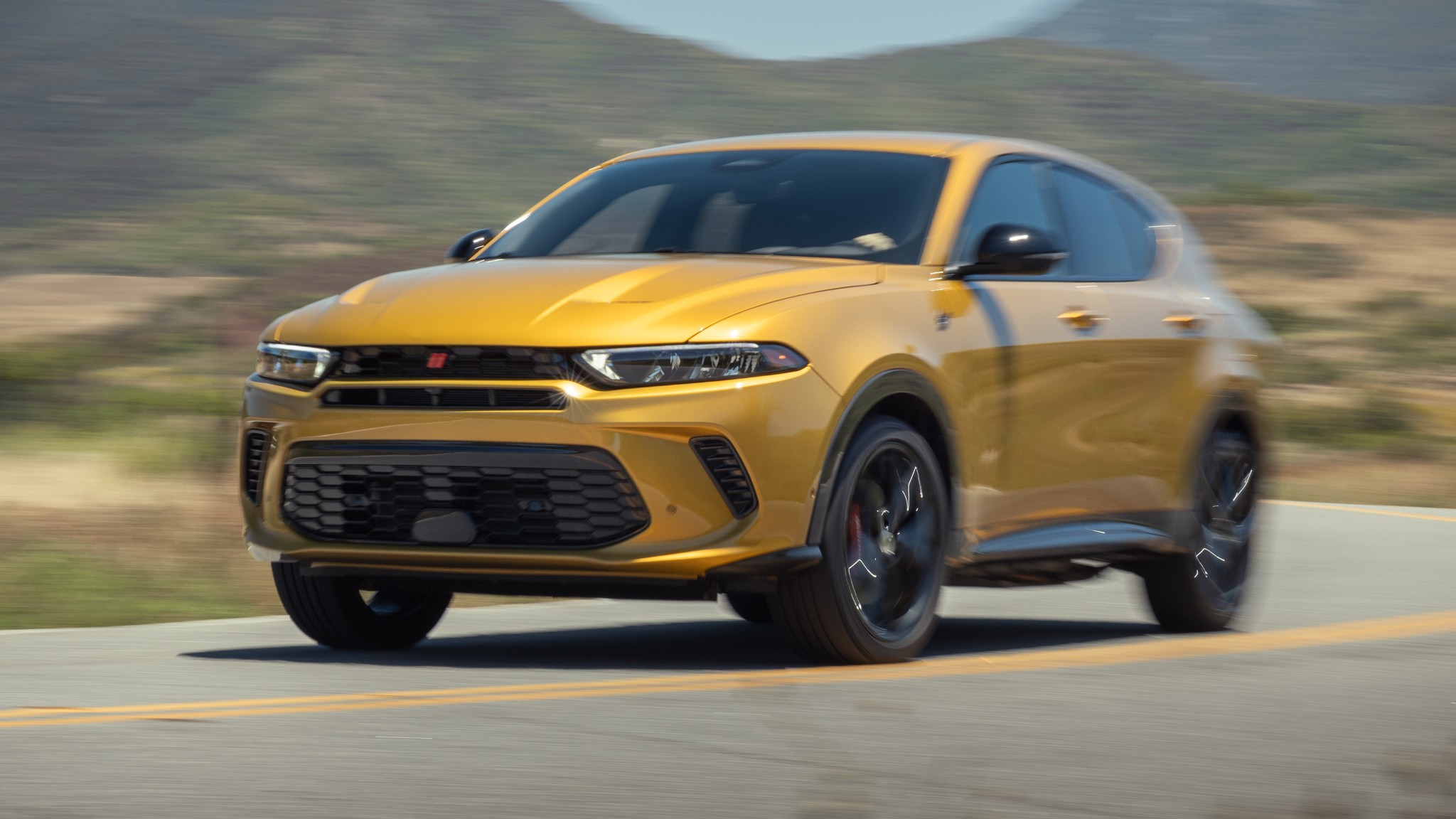 001 2024 Dodge Hornet R T front three quarters in action