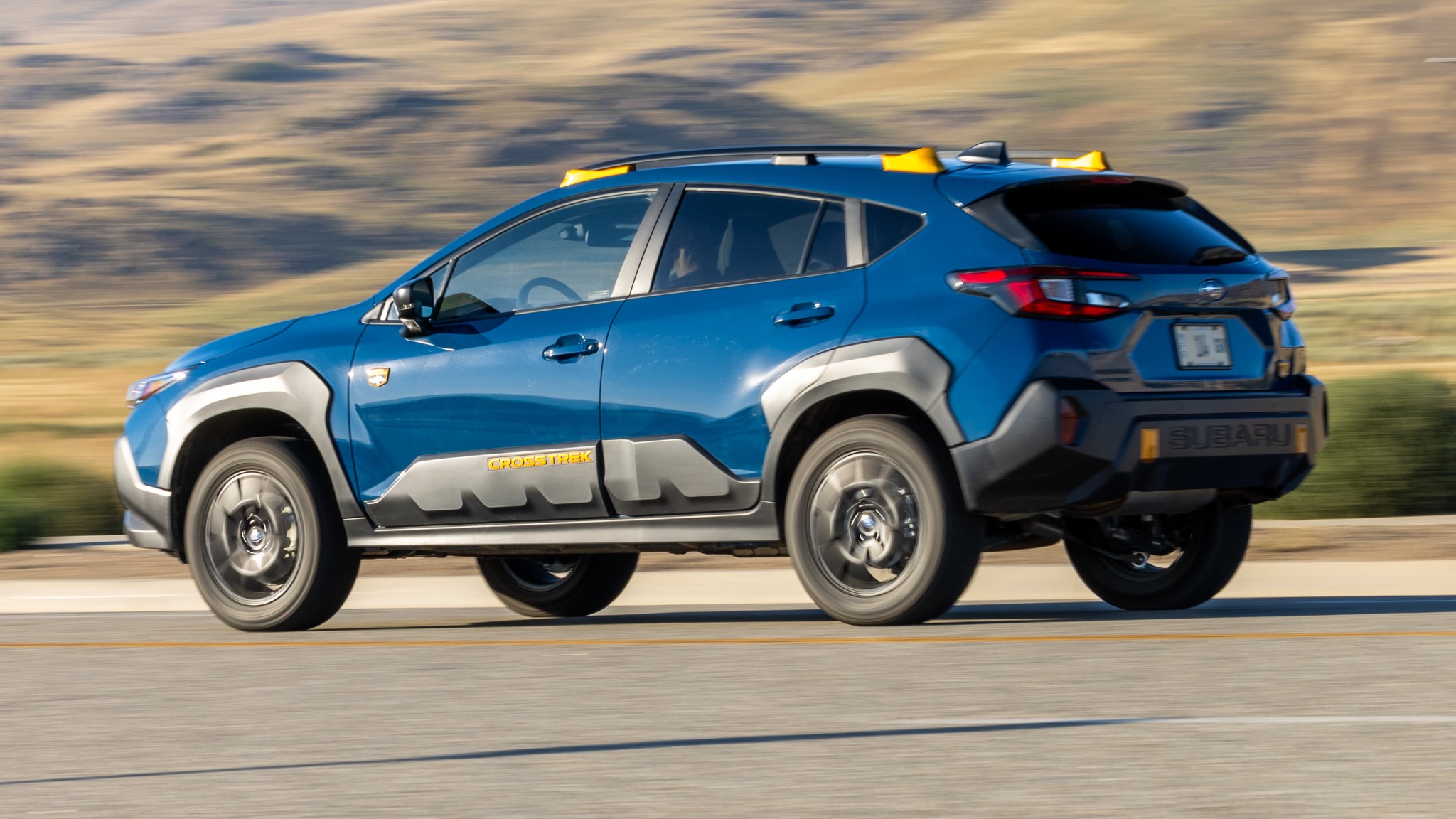 008 2024 Subaru Crosstrek Wilderness rear three quarters in action