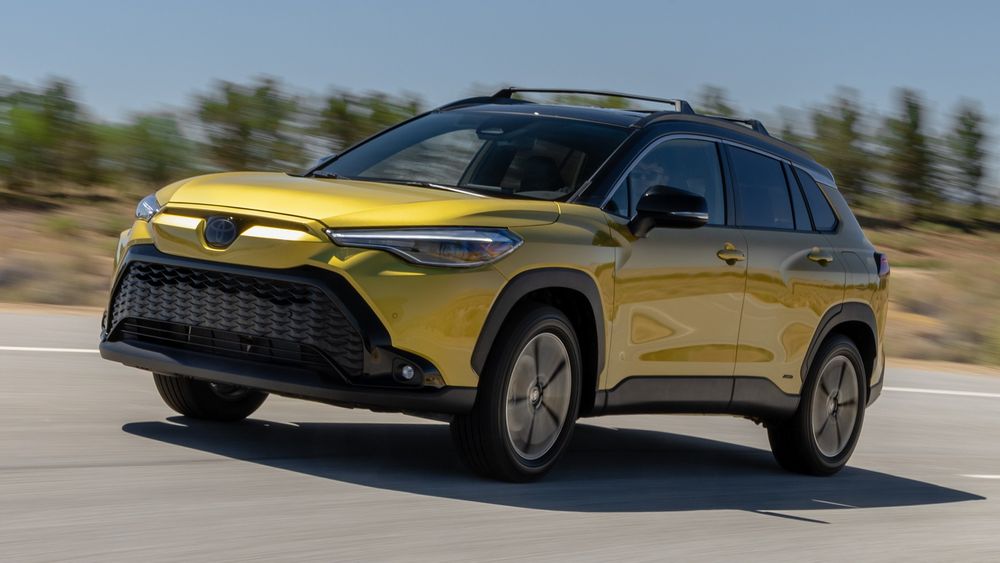 001 2023 Toyota Corolla Cross Hybrid front three quarters in action