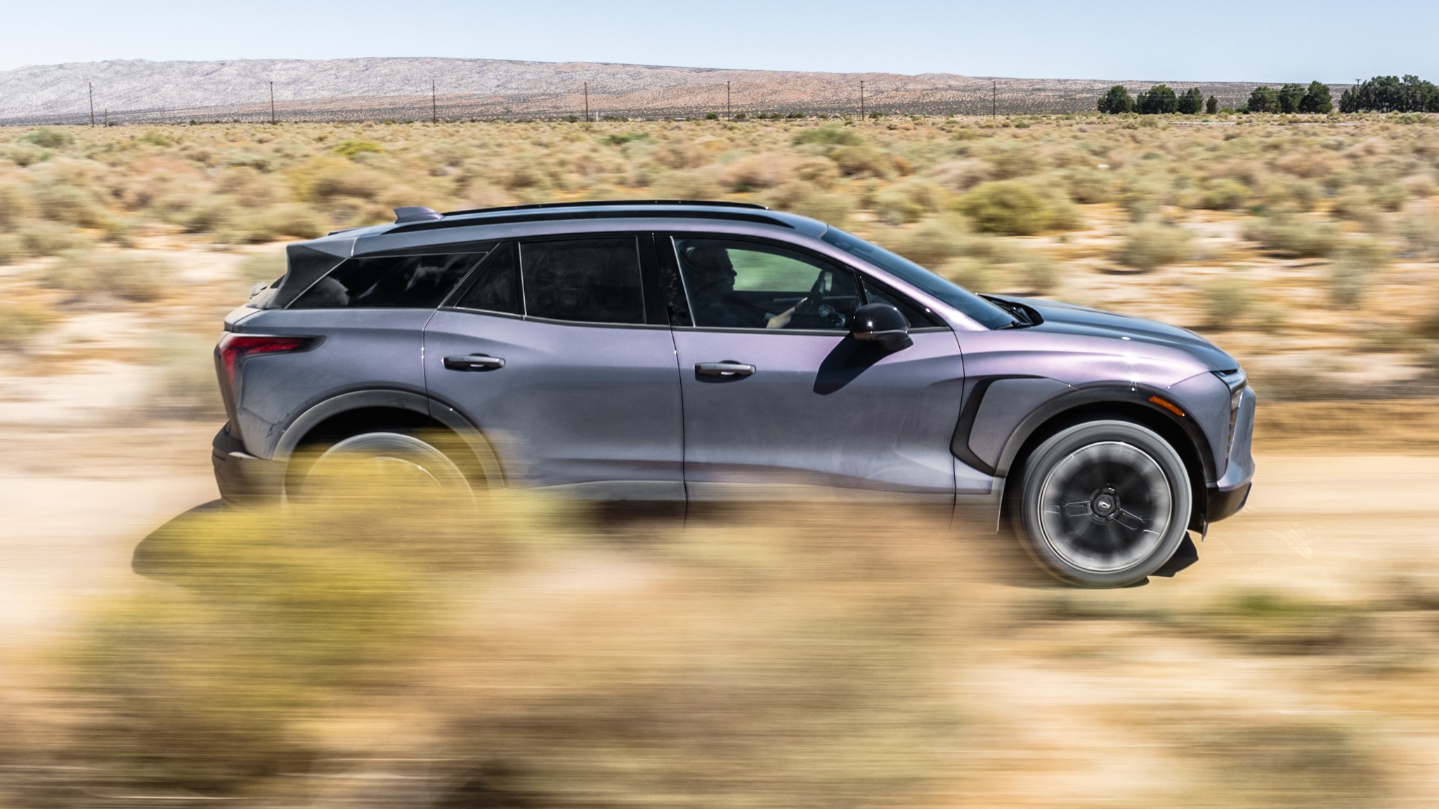 006 2023 Chevrolet Blazer EV RS side in motion view