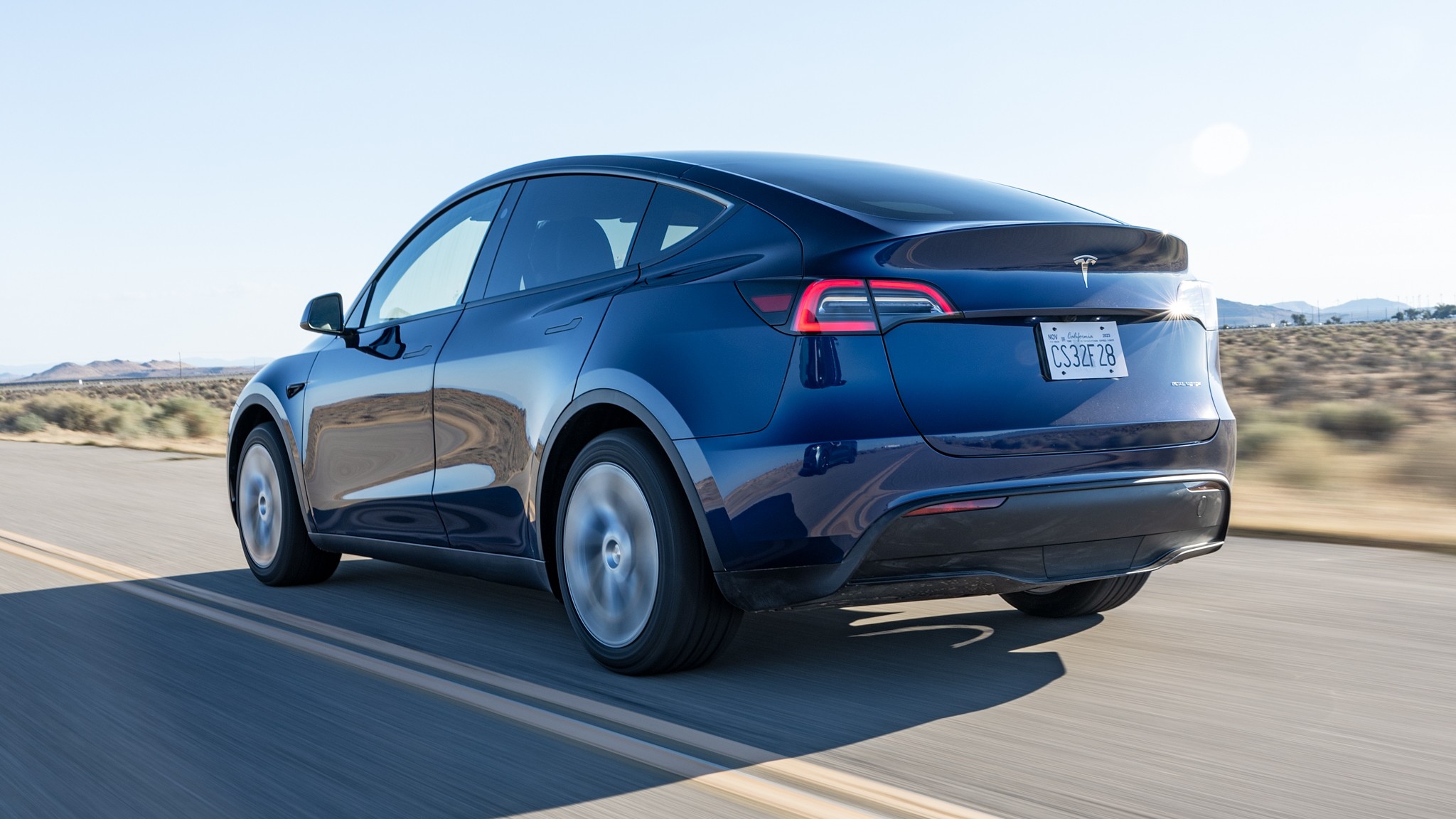 001 2023 tesla model y rear in motion