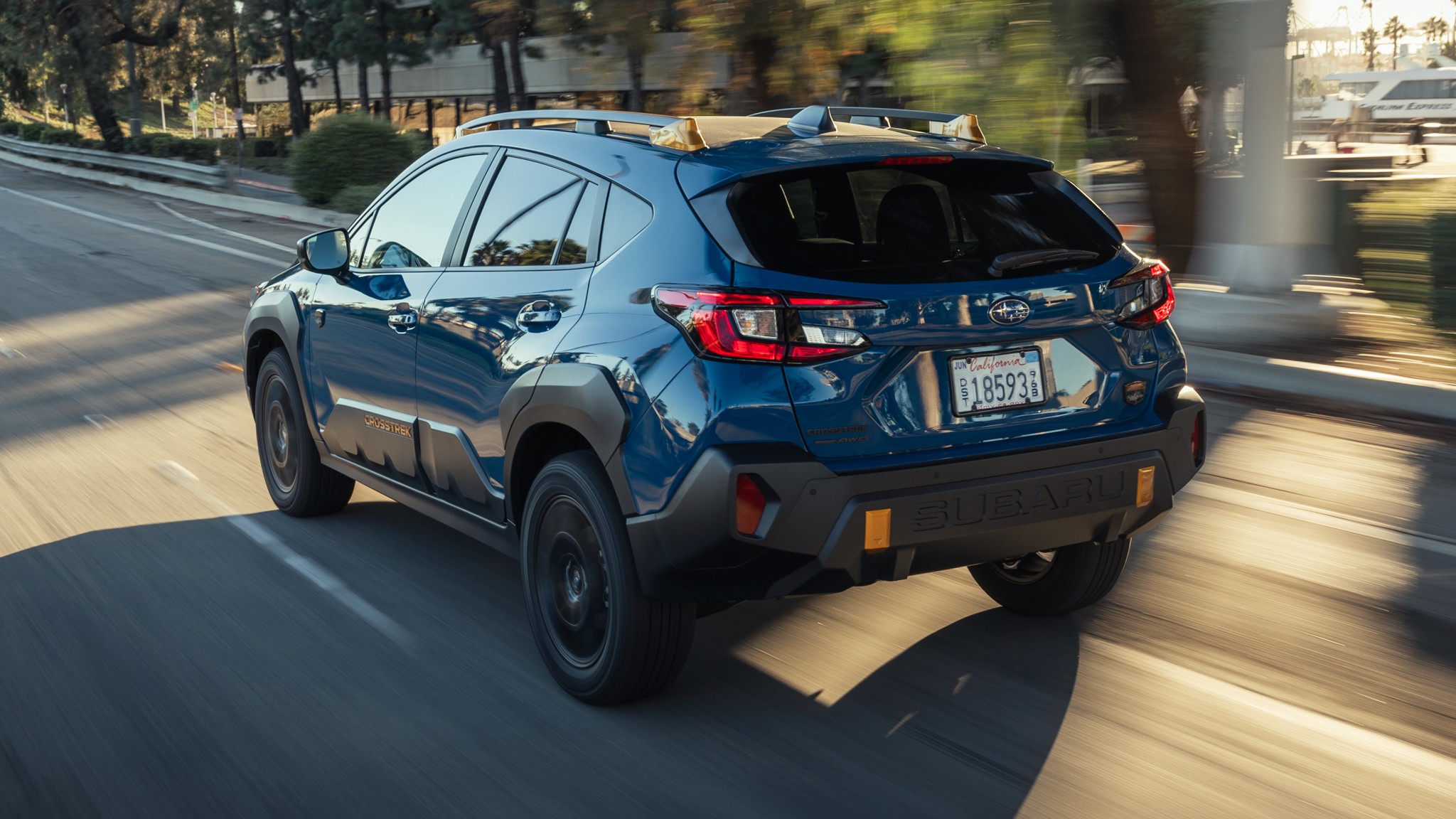 002 2024 subaru crosstrek wilderness rear in motion view