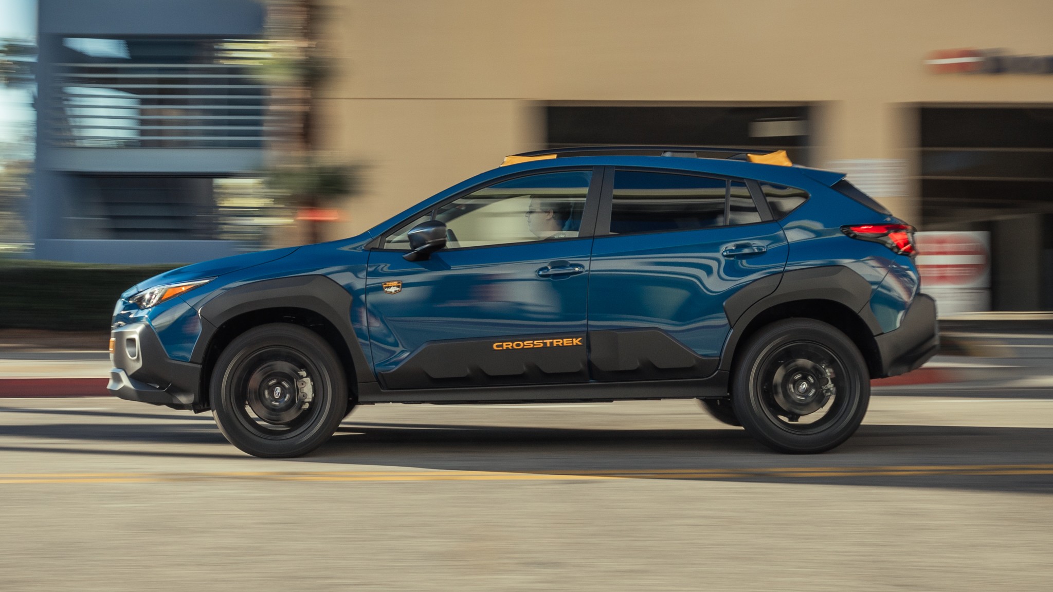 009 2024 subaru crosstrek wilderness side in motion view