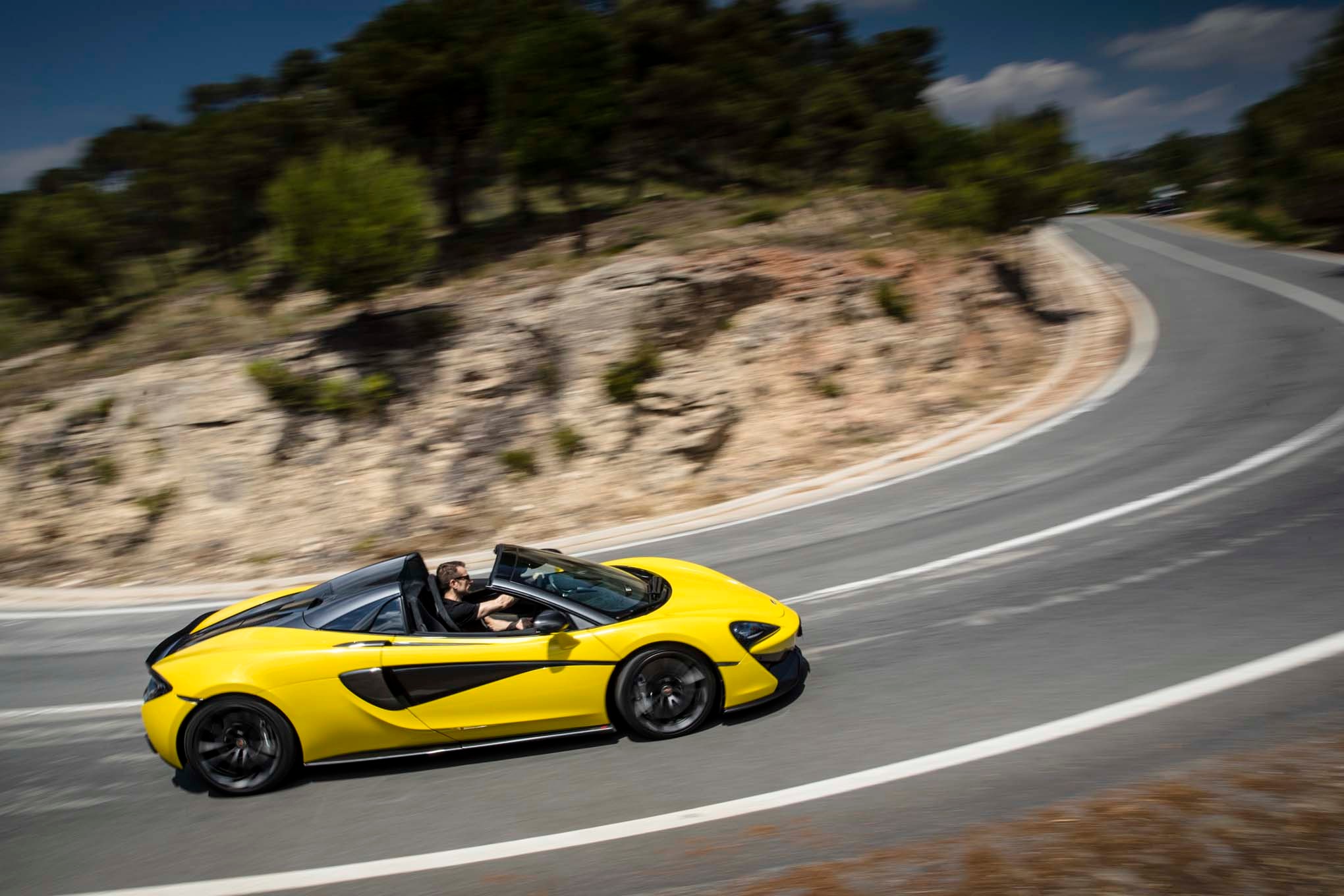 2017 Mclaren 570S Spider side in motion 08
