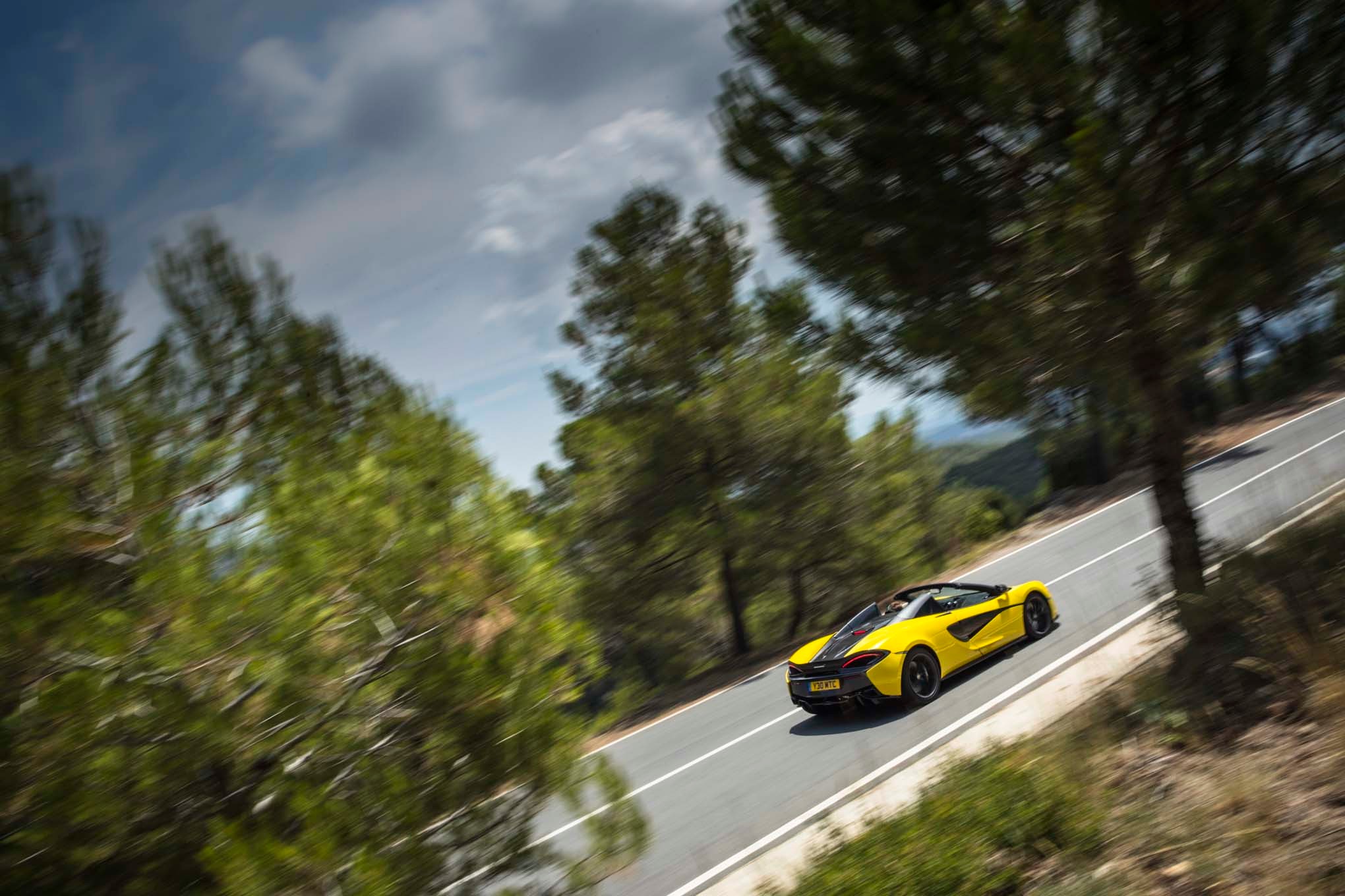 2017 Mclaren 570S Spider rear side in motion 05