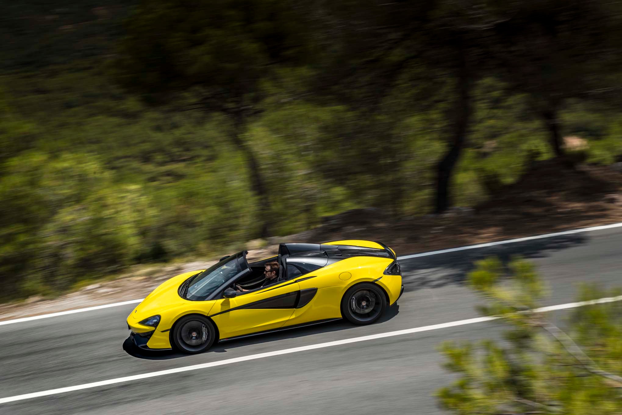 2017 Mclaren 570S Spider side in motion 05