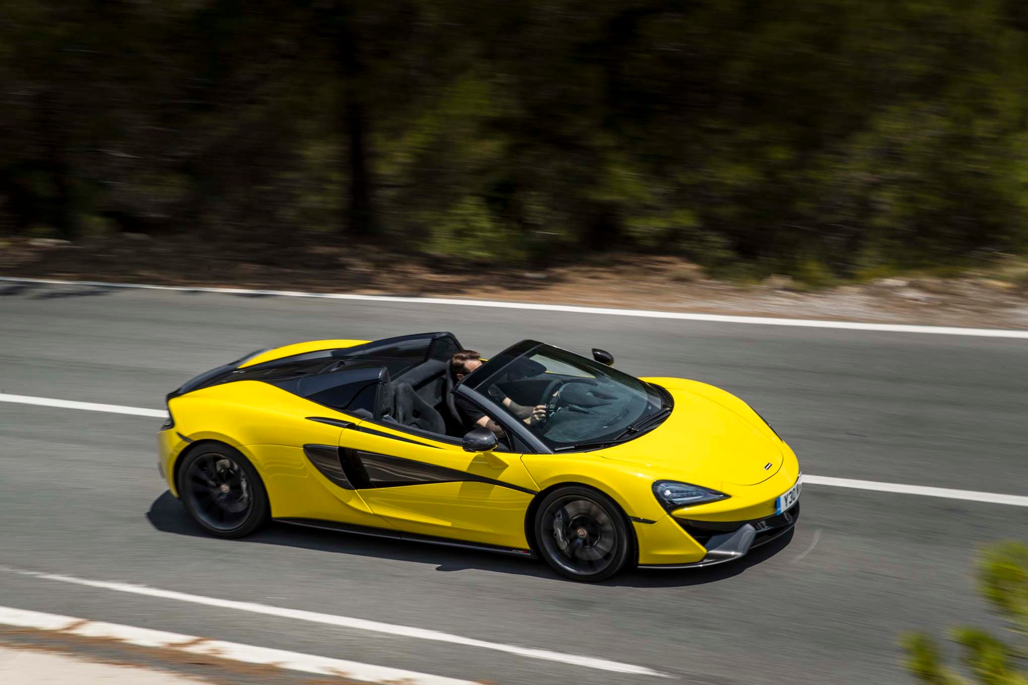 2017 Mclaren 570S Spider side in motion 04