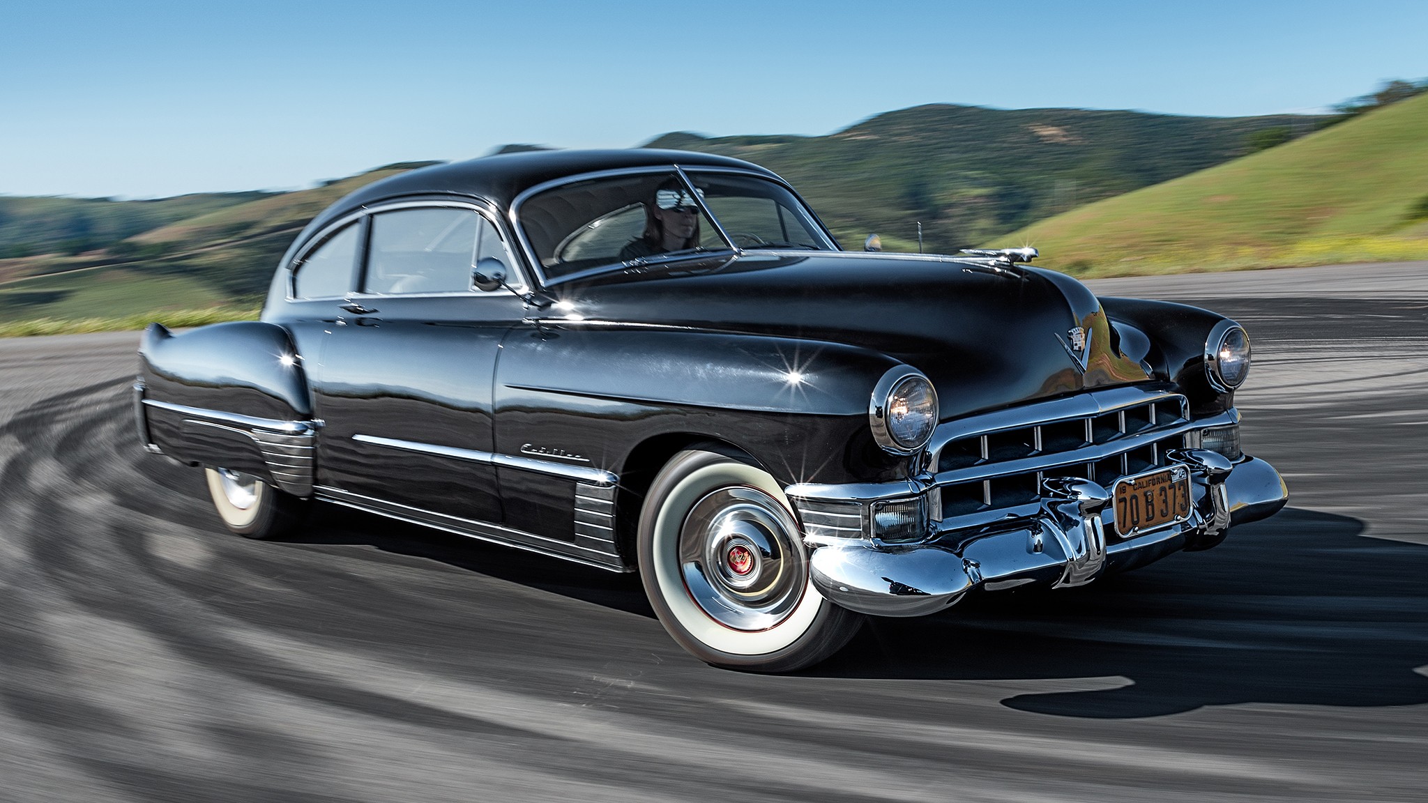 1949 Cadillac Series 62 Sedanette front three quarter in motion 2