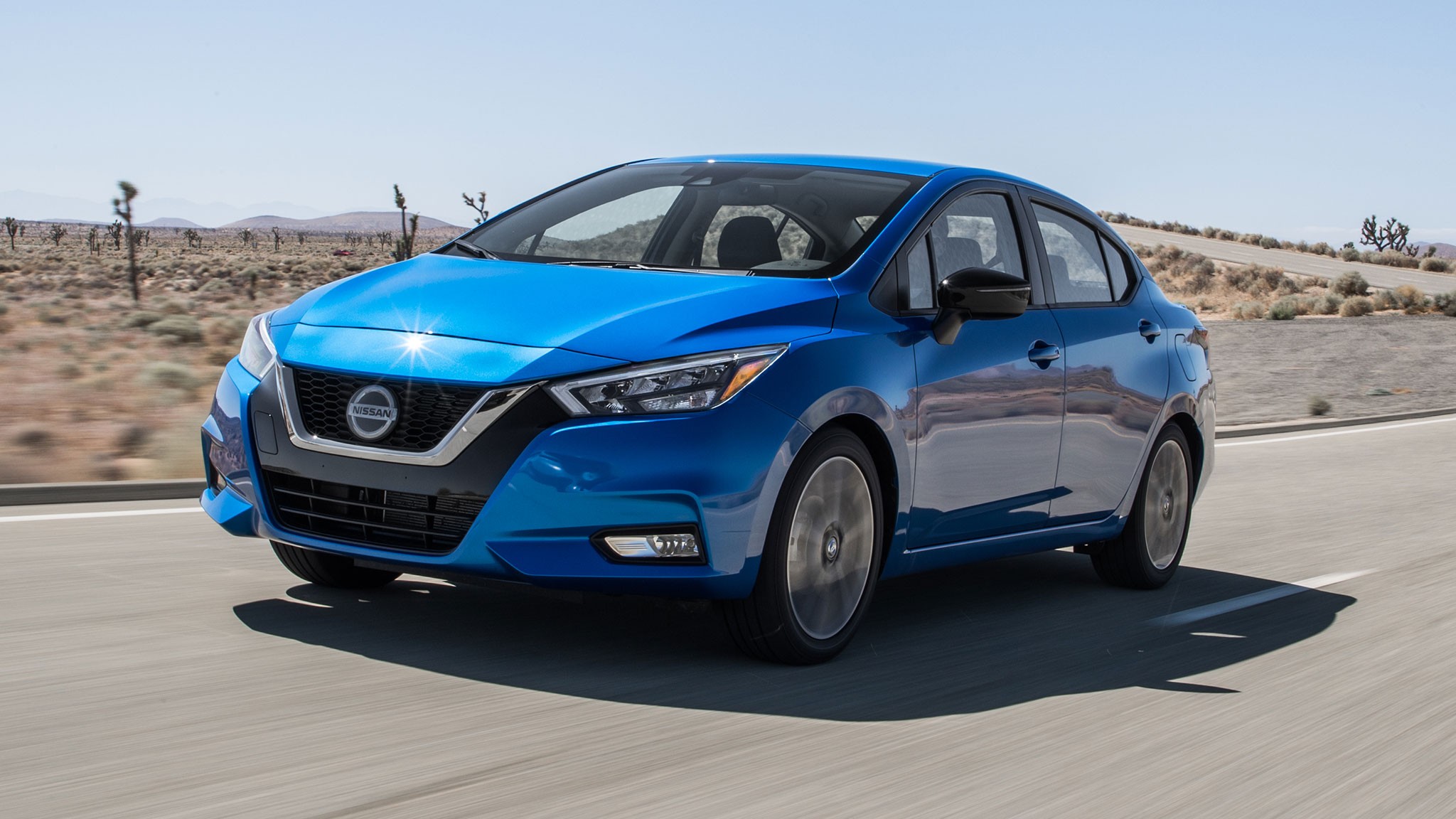 2020 Nissan Versa SR front three quarter in motion 3