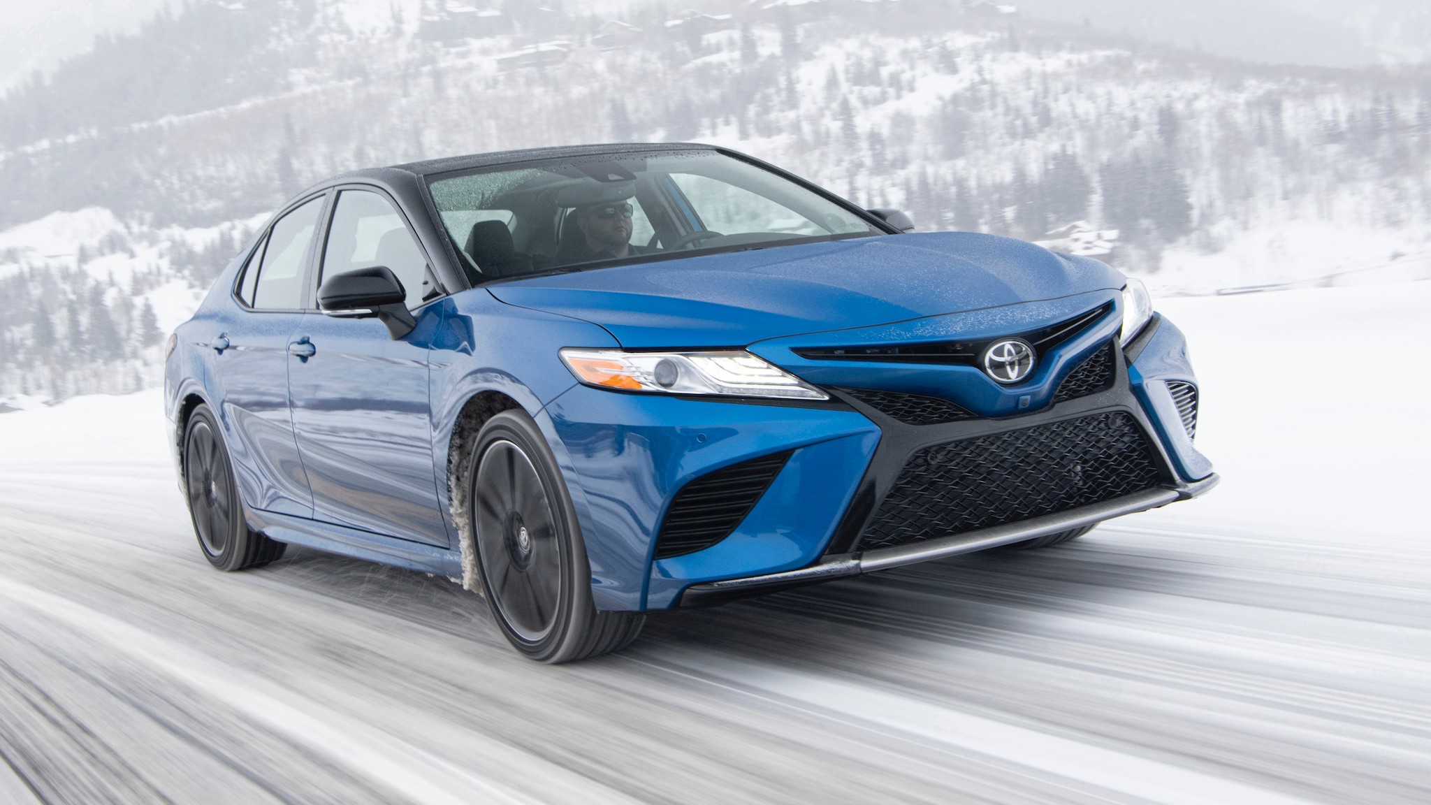 2020 Toyota Camry XSE AWD front three quarter action in snow