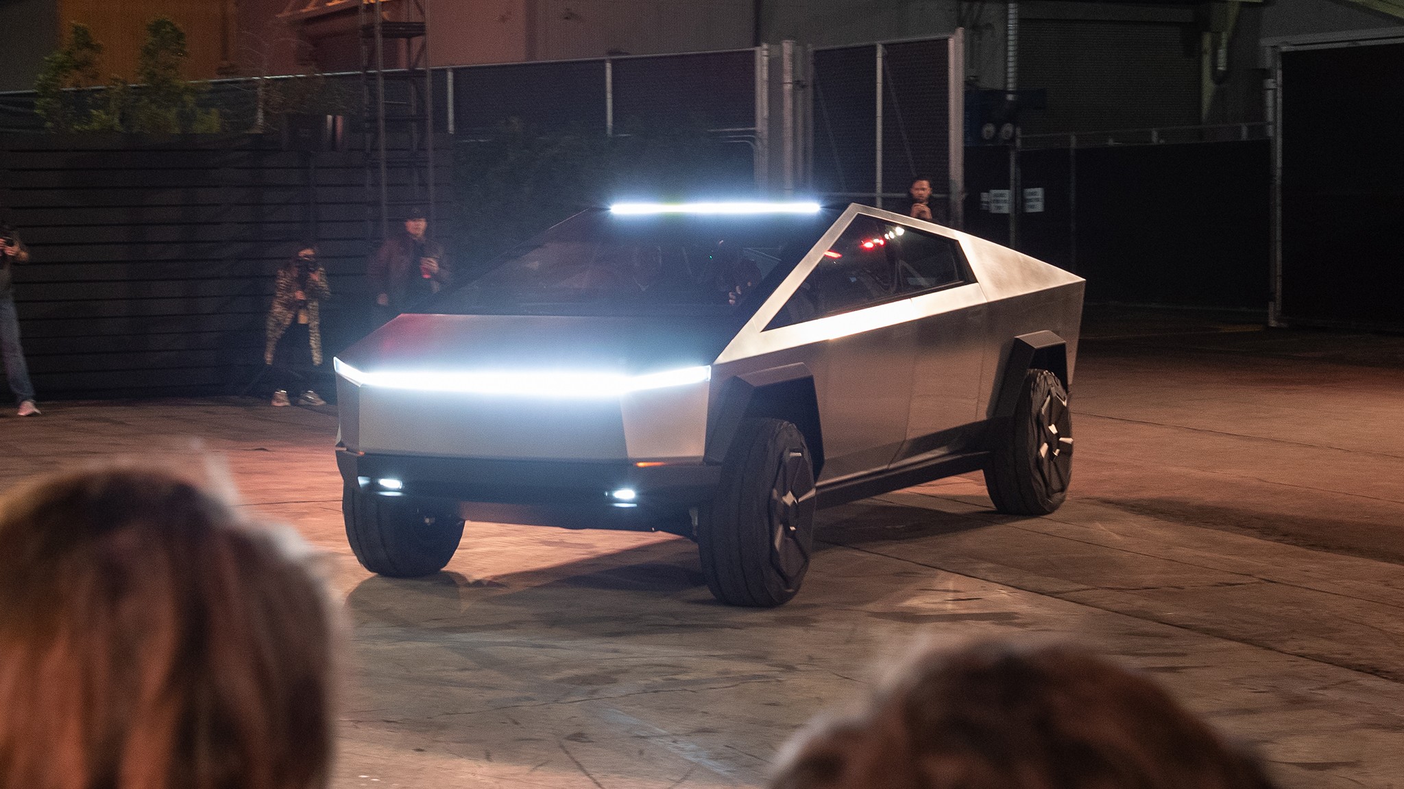 Tesla Cybertruck electric pickup above heads