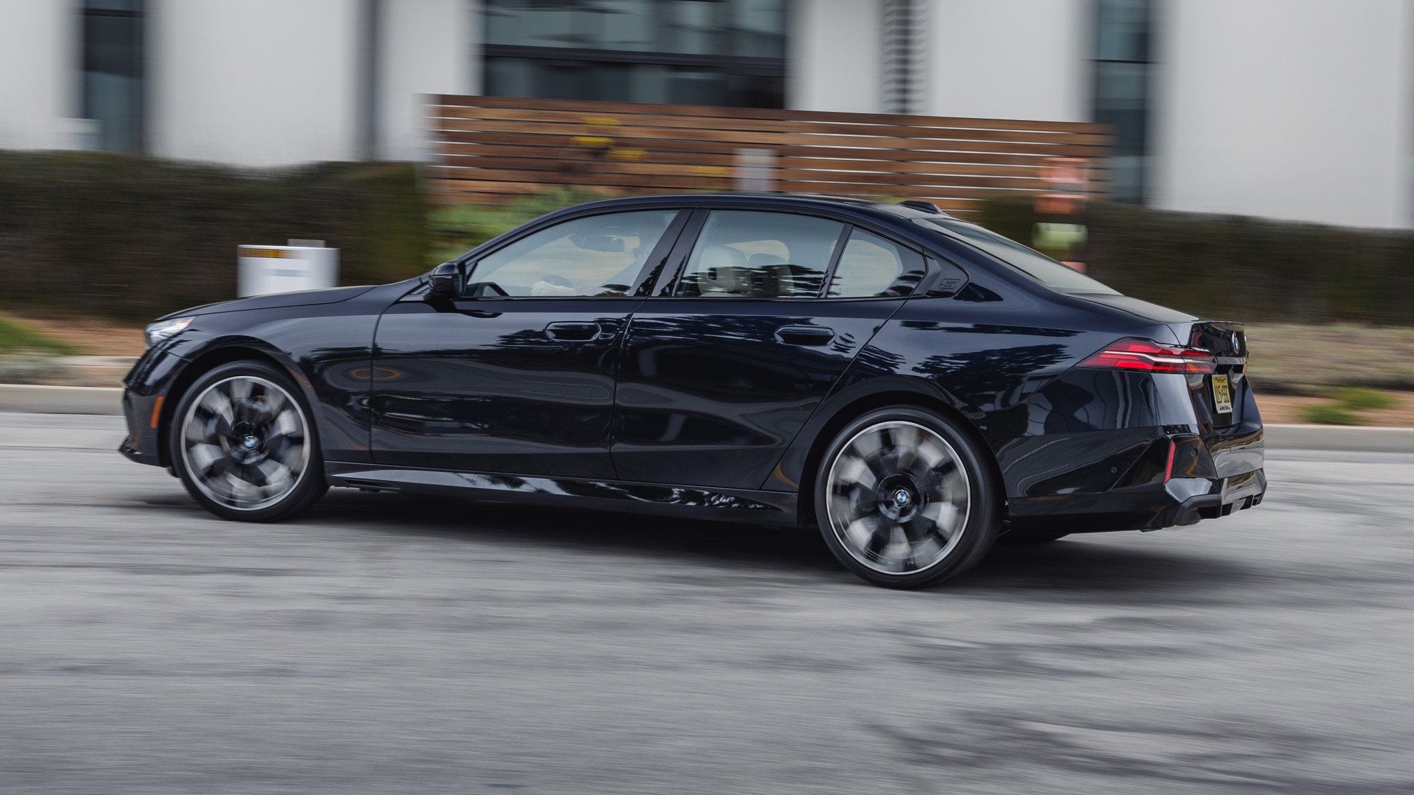 005 2024 BMW 530i RWD Rear Three Quarter Action