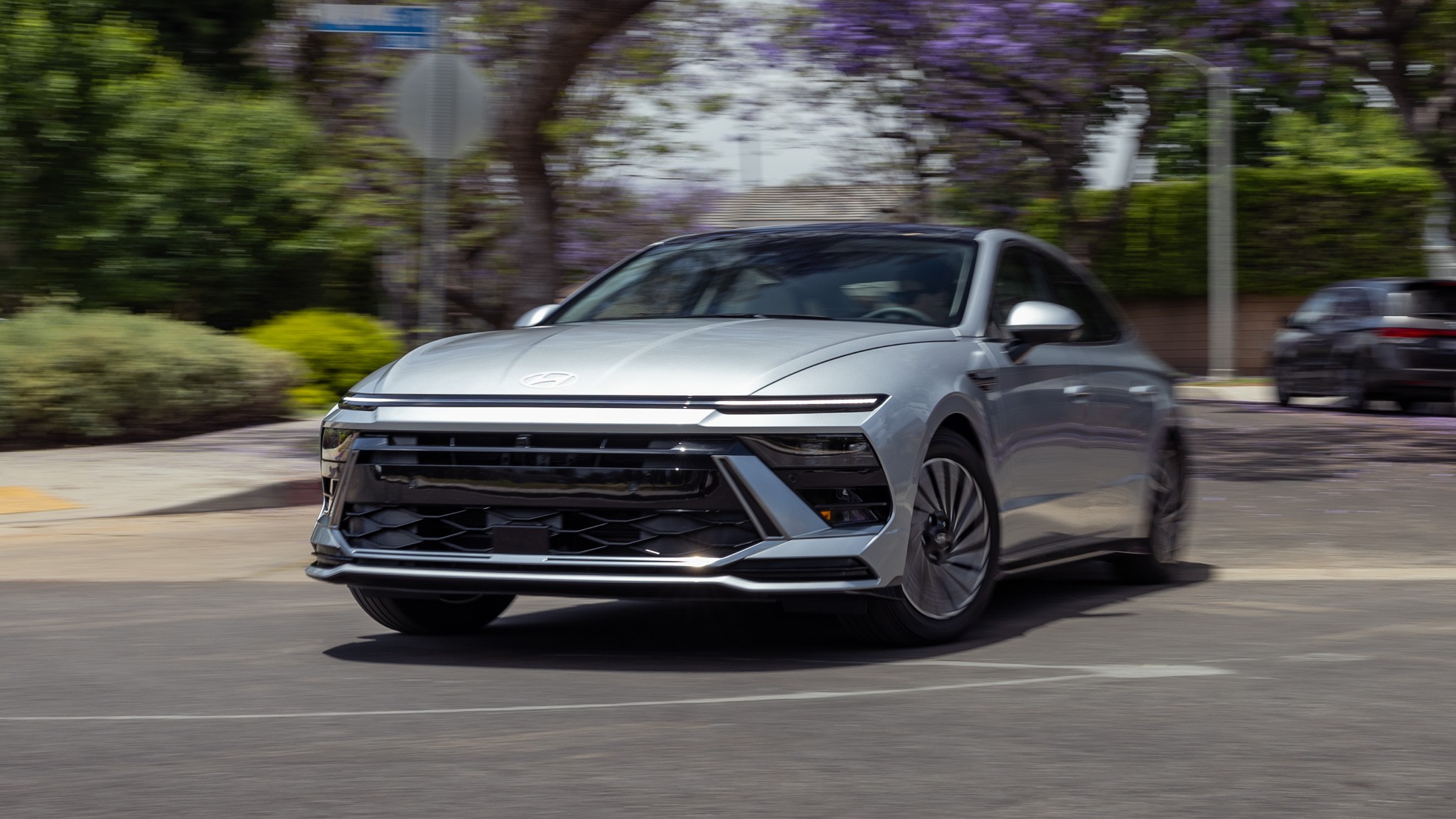 001 2024 Hyundai Sonata Hybrid Front Three Quarter Actions LEAD