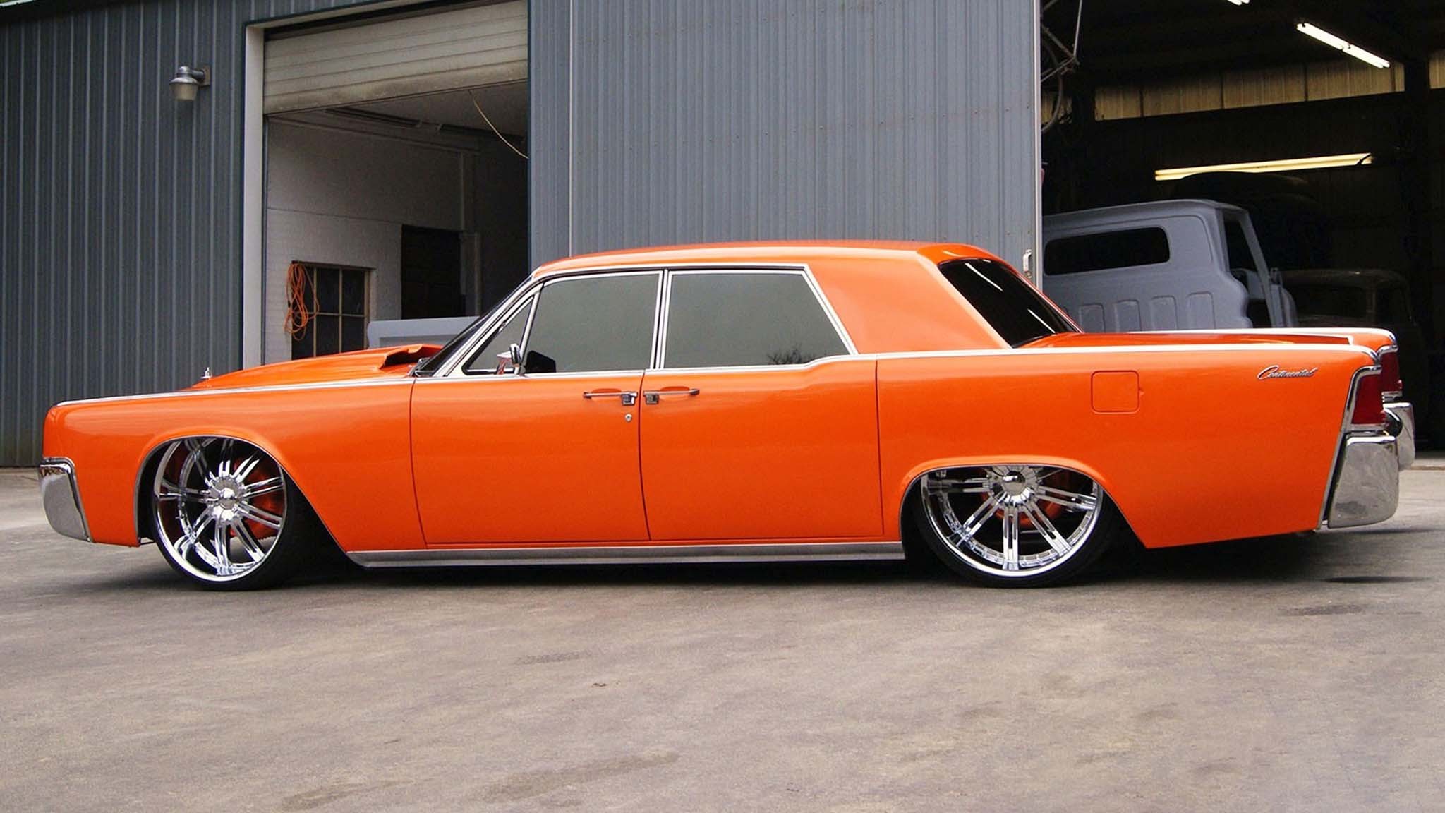 002 old school cars 1964 lincoln continental lowrider orange side view