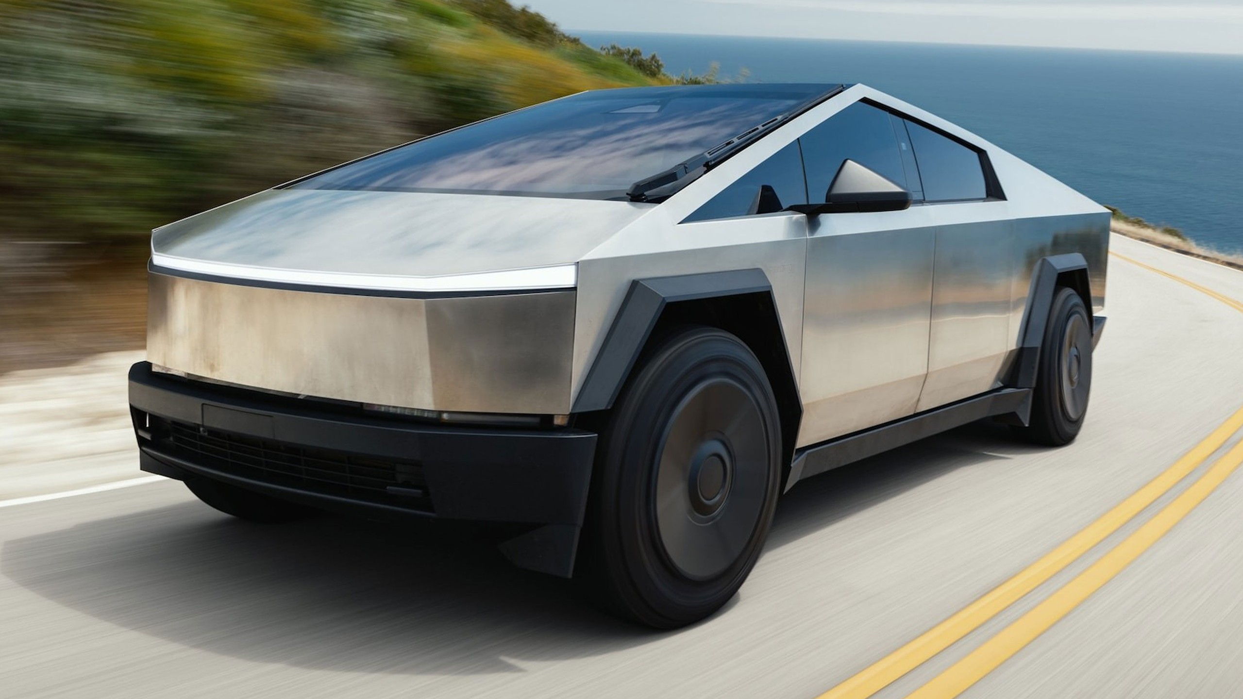 012 ugly truck 2024 tesla cyberbeast driving silver front three quarter