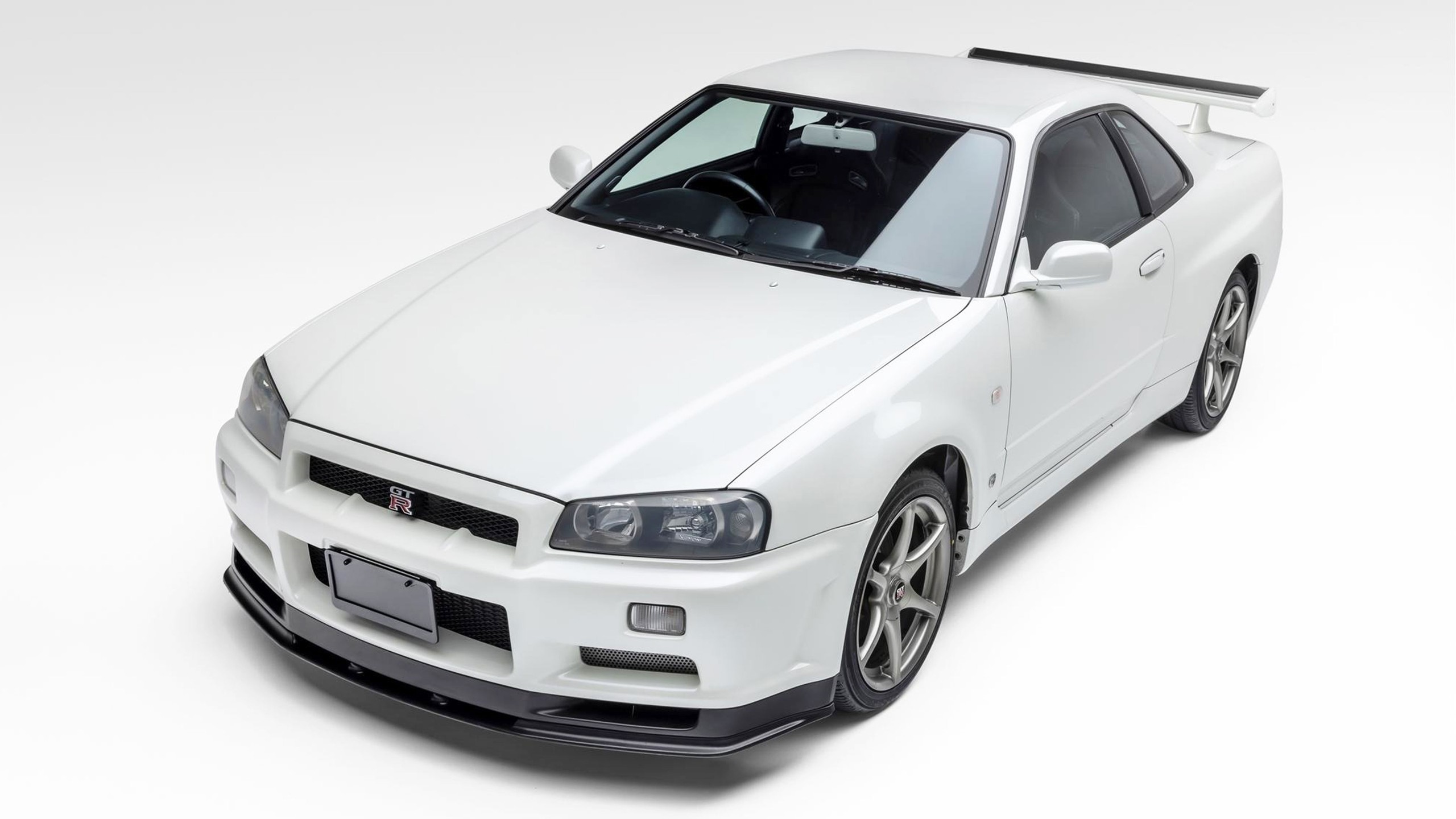 004 import cars from japan 2002 nissan skyline r34 gt r white front three quarter