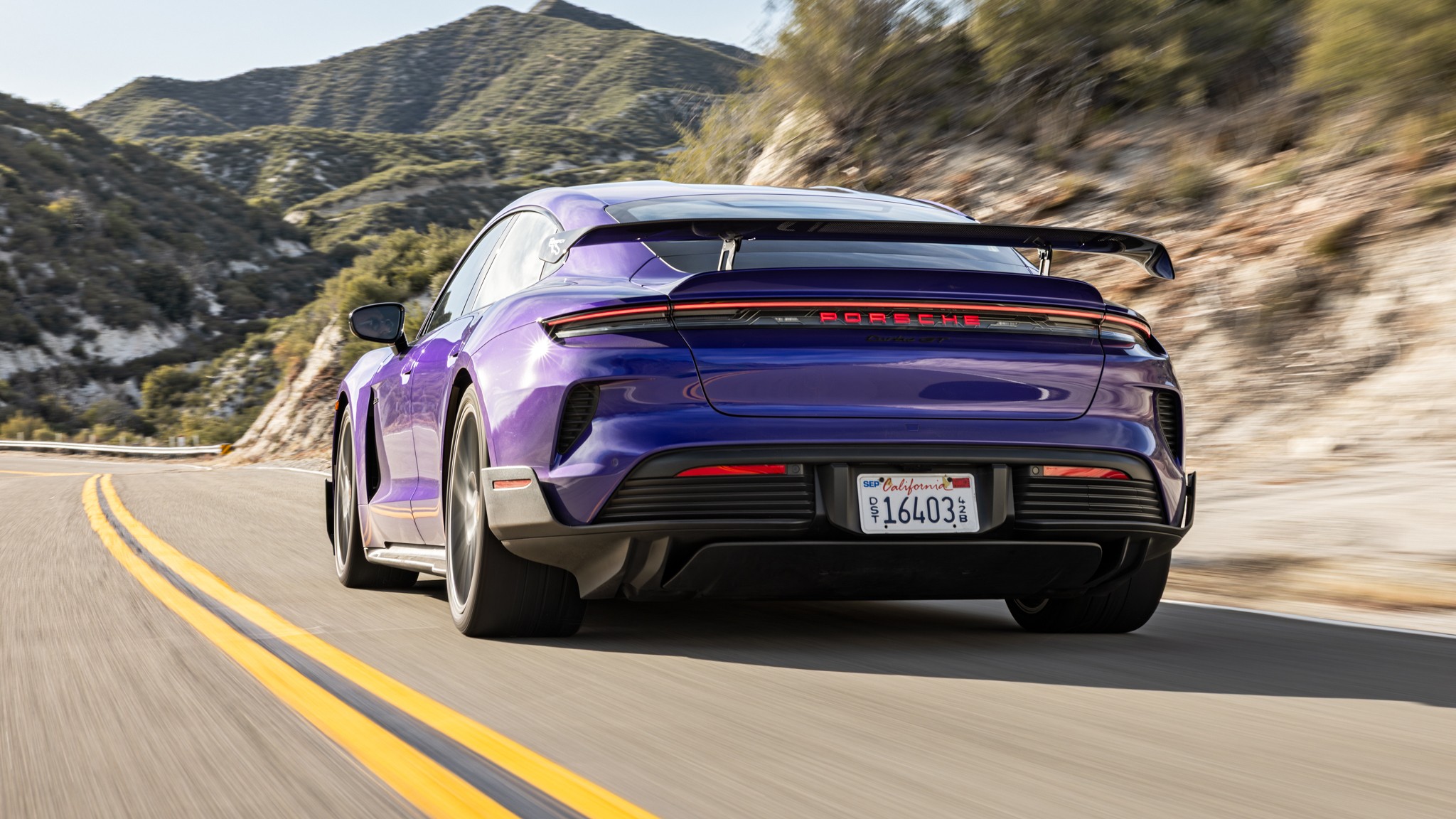 002 2025 Porsche Taycan Turbo GT Weissach Road Rear Three Quarter Action