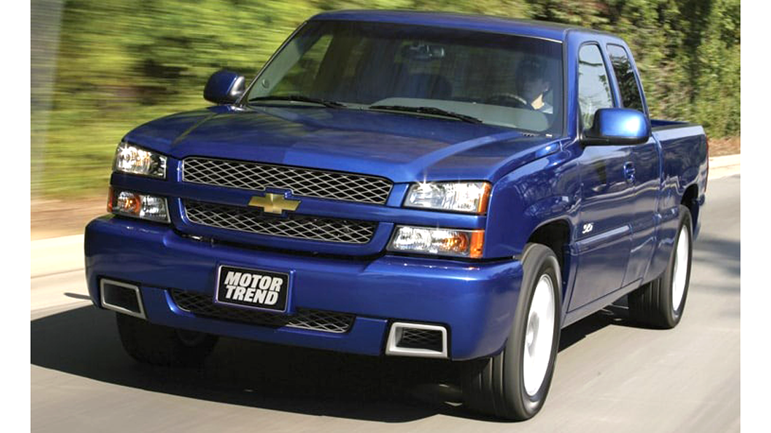 009 cat eye chevy truck blue front three quarter driving