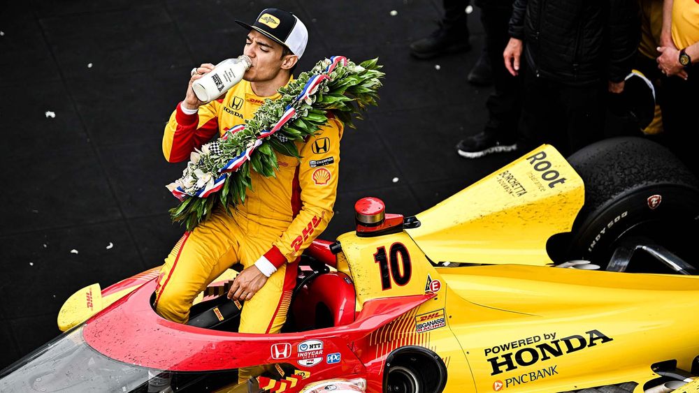 Alex Palou drinks milk after winning the 2025 Indianapolis 500