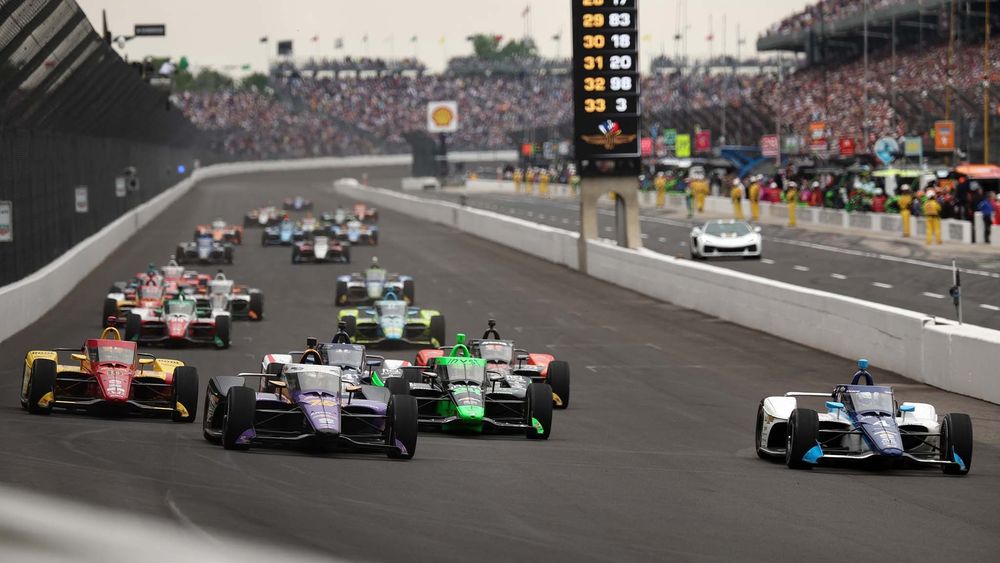Conor Daly driver of the 76 Juncos Hollinger Racing Chevrolet leads a pack of cars during the 2025 Indianapolis 500