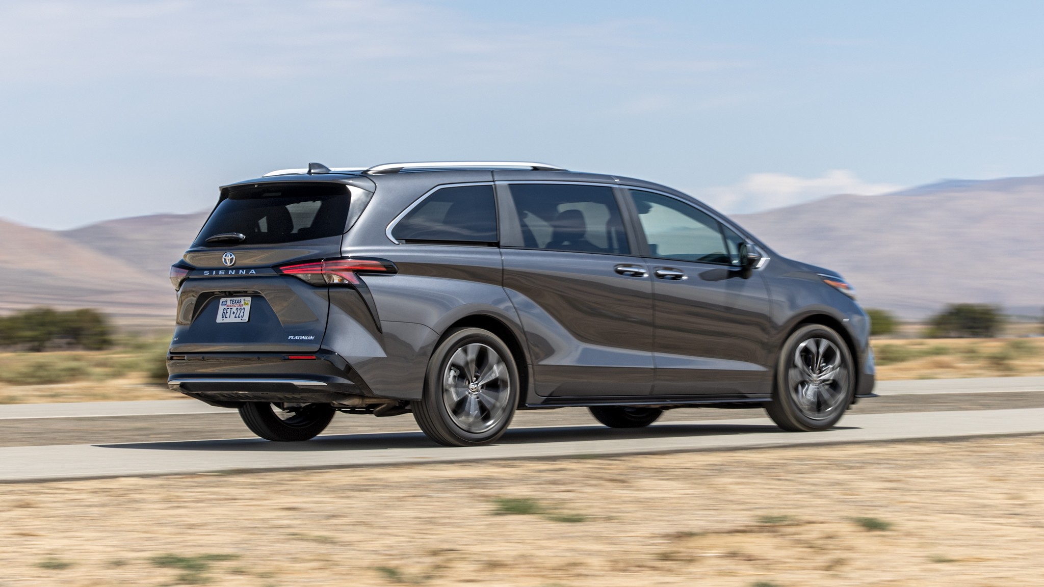 002 2025 Toyota Sienna Platinum Rear Three Quarter Action