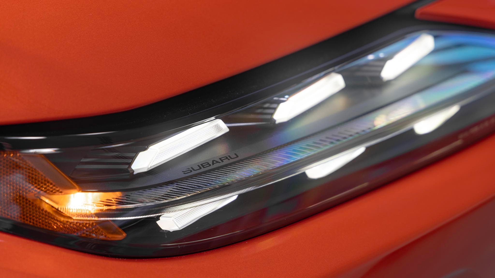 2025 Subaru Uncharted close up of headlamp from above showing small Subaru wordmark