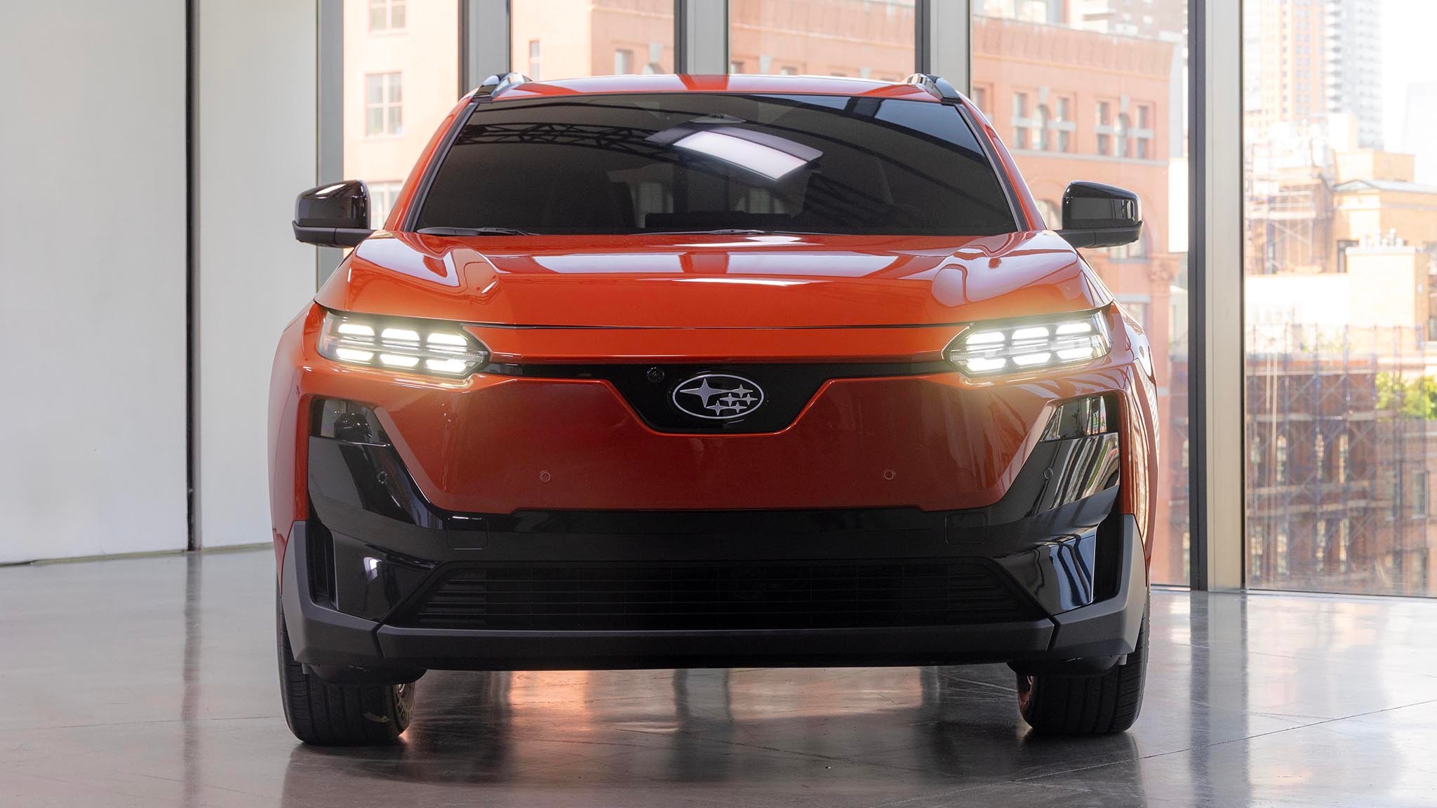 2025 Subaru Uncharted head on with headlights on