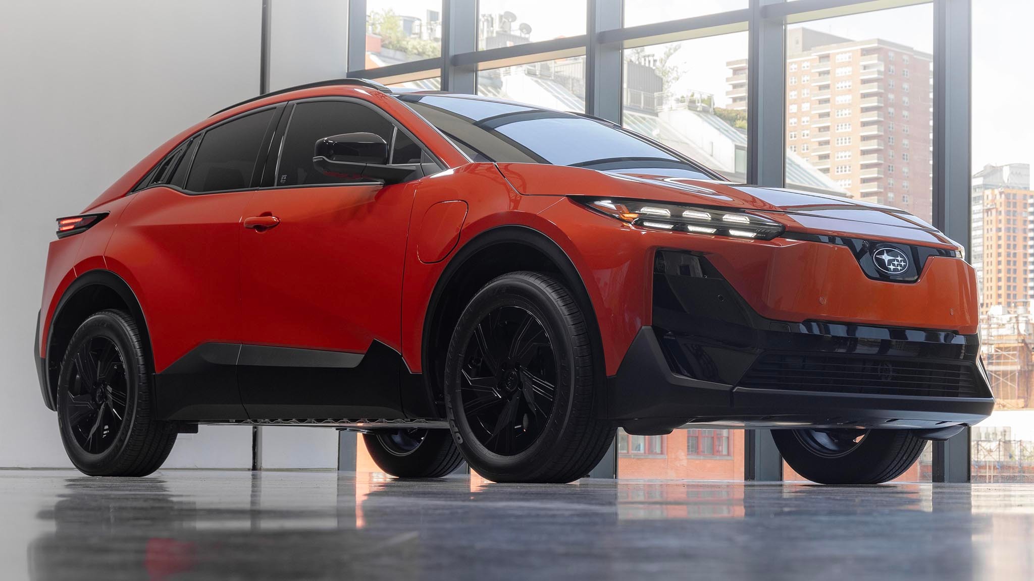 2025 Subaru Uncharted in orange at low front three quarter angle