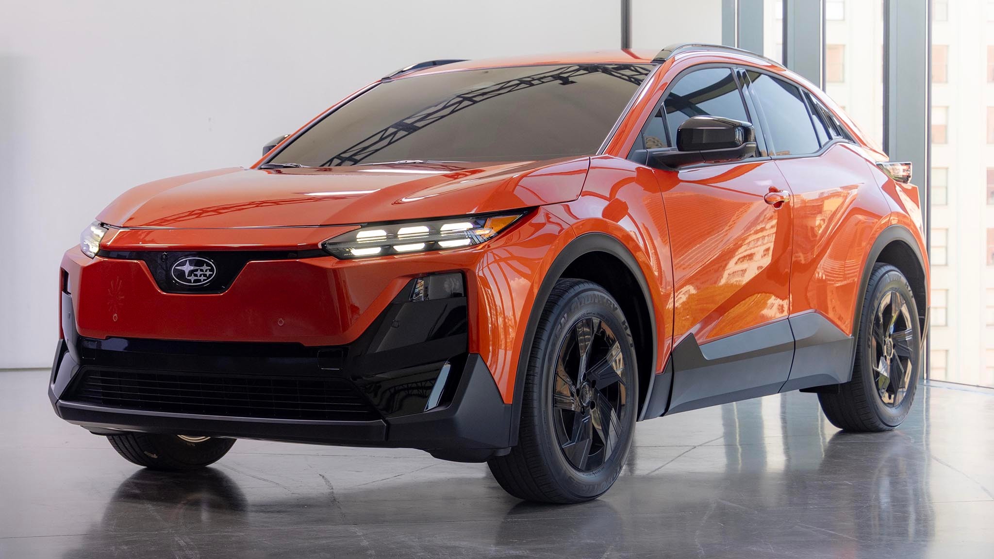 2025 Subaru Uncharted in orange driver s side front three quarters