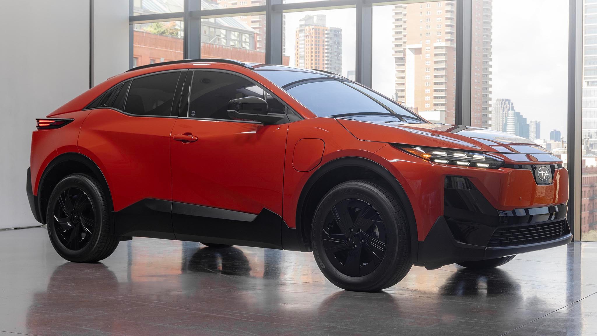 2025 Subaru Uncharted in orange front three quarters