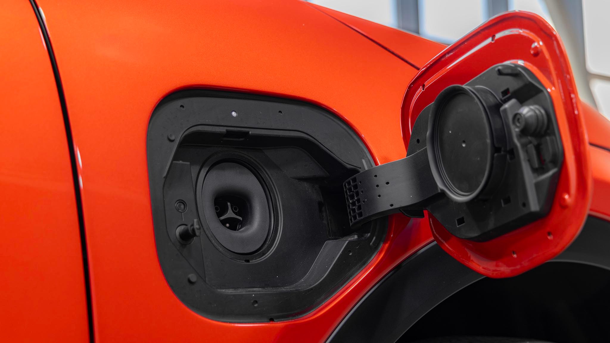 2025 Subaru Uncharted open charge port door with NACS connection on right front fender