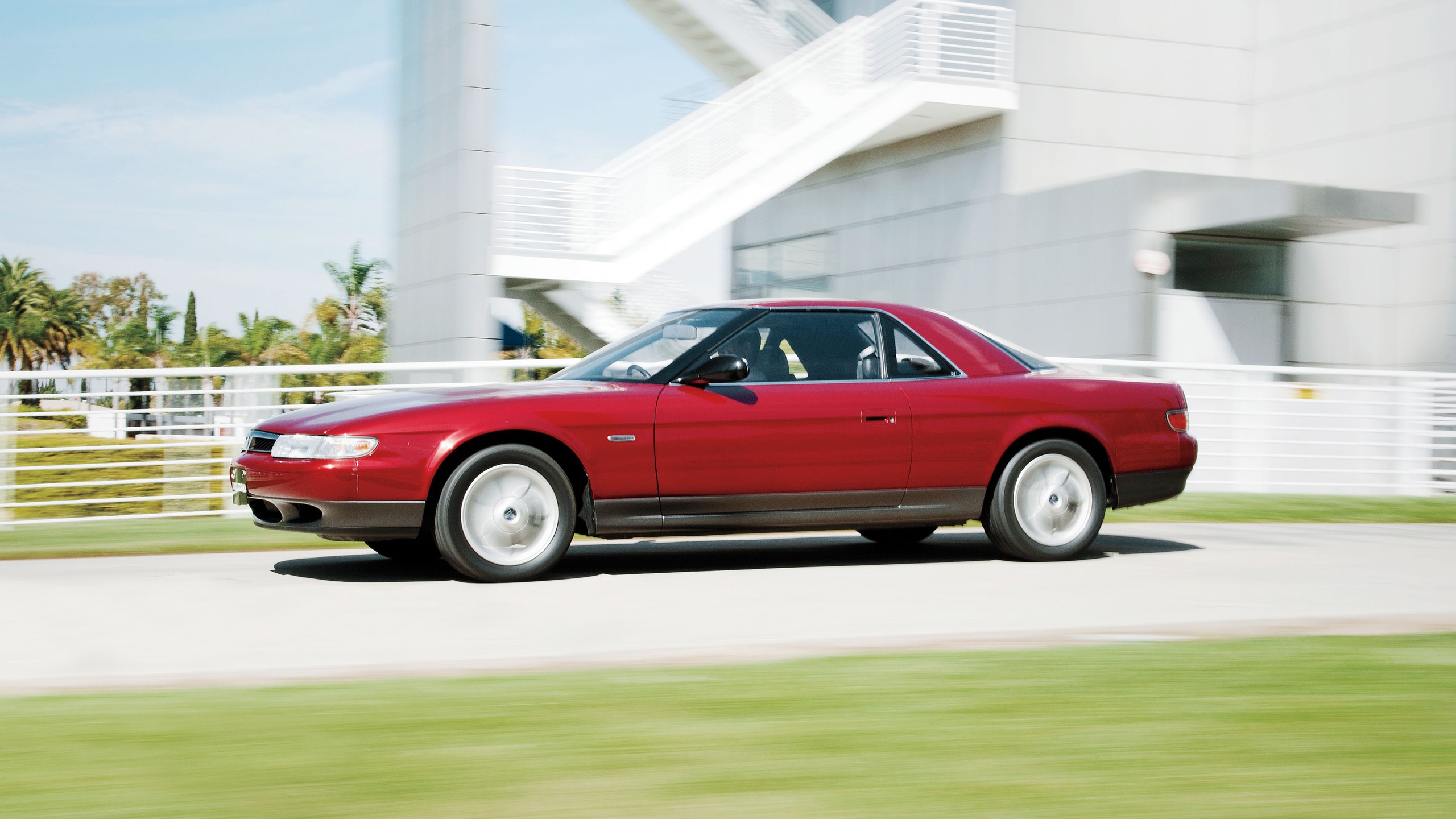 002 1993 mazda eunos cosmo rare 3 rotor red side view driving luxury coupe