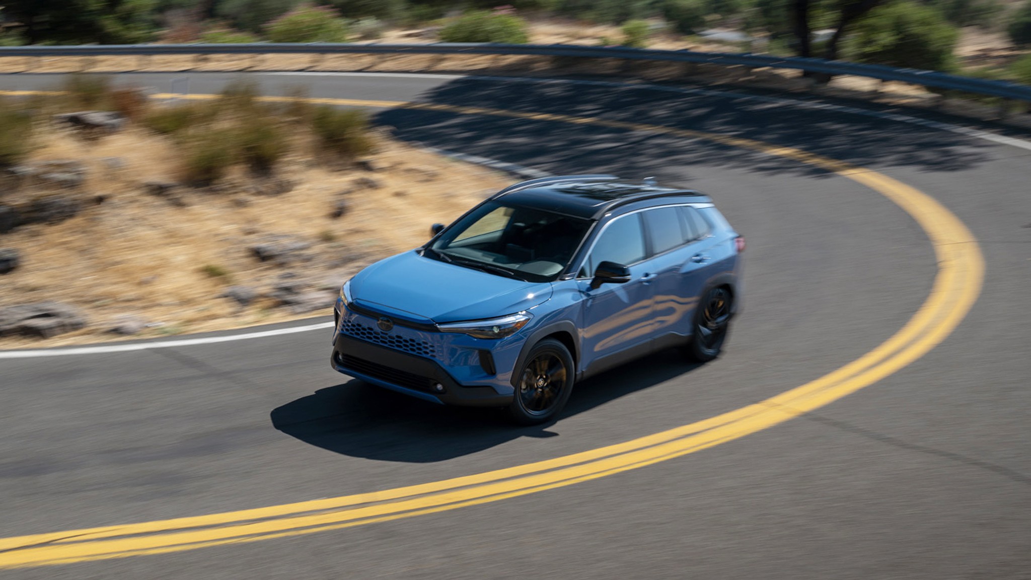2026 Toyota Corolla Cross Hybrid XSE AWD blue panning 318