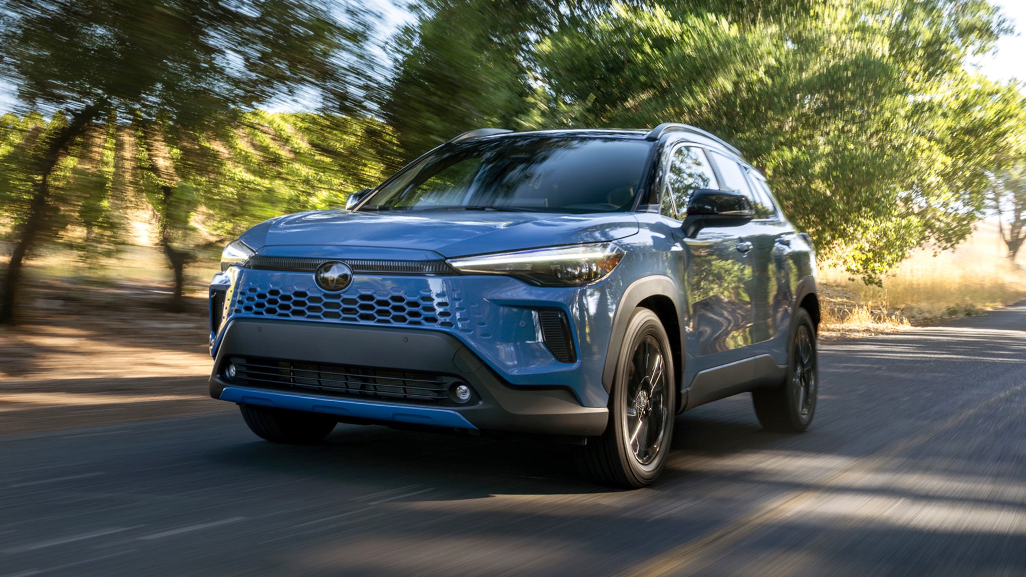 2026 Toyota Corolla Cross Hybrid XSE AWD blue action 208