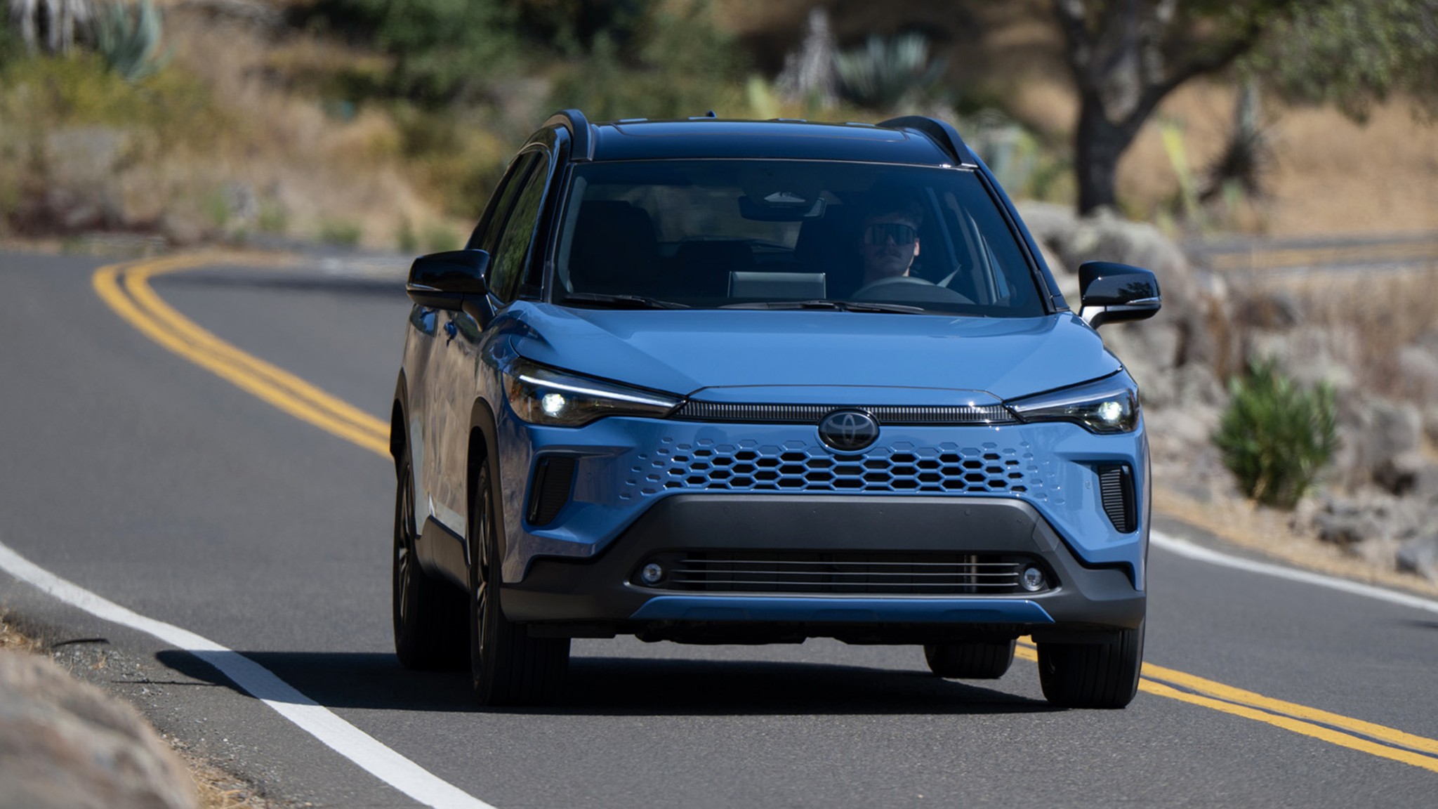 2026 Toyota Corolla Cross Hybrid XSE AWD blue front action 307