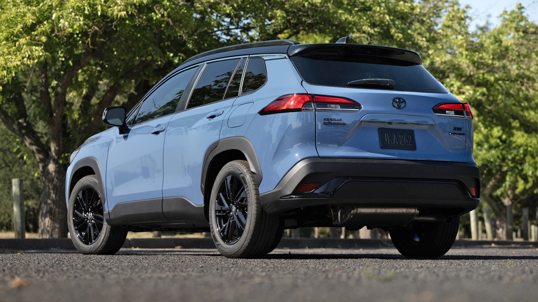 2026 Toyota Corolla Cross Hybrid XSE AWD blue rear three quarter 014