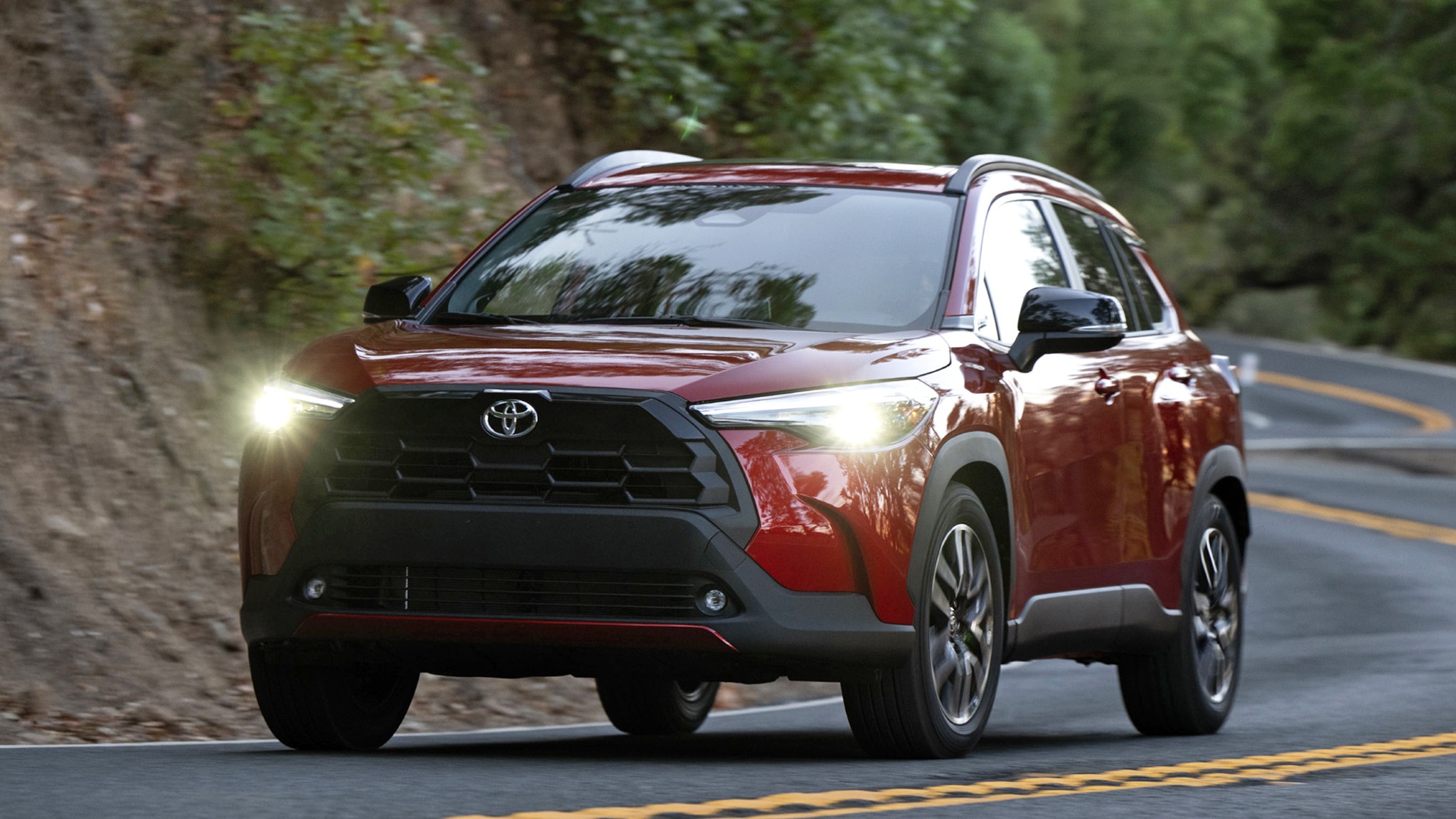 2026 Toyota Corolla Cross XLE AWD red action headlights on 308