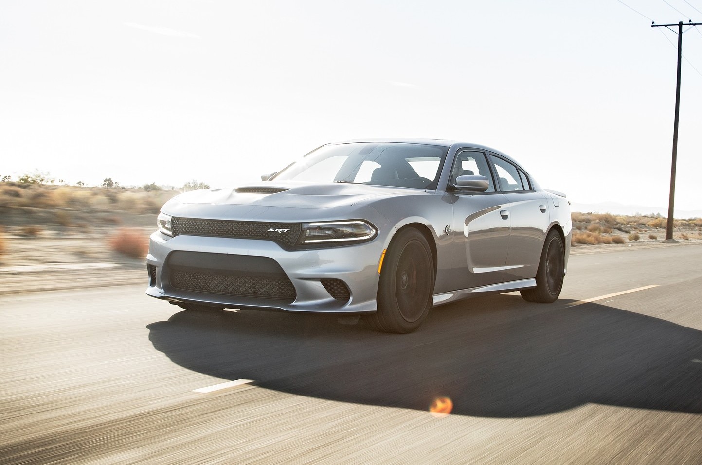 2015 Dodge Charger SRT Hellcat front three quarter in motion