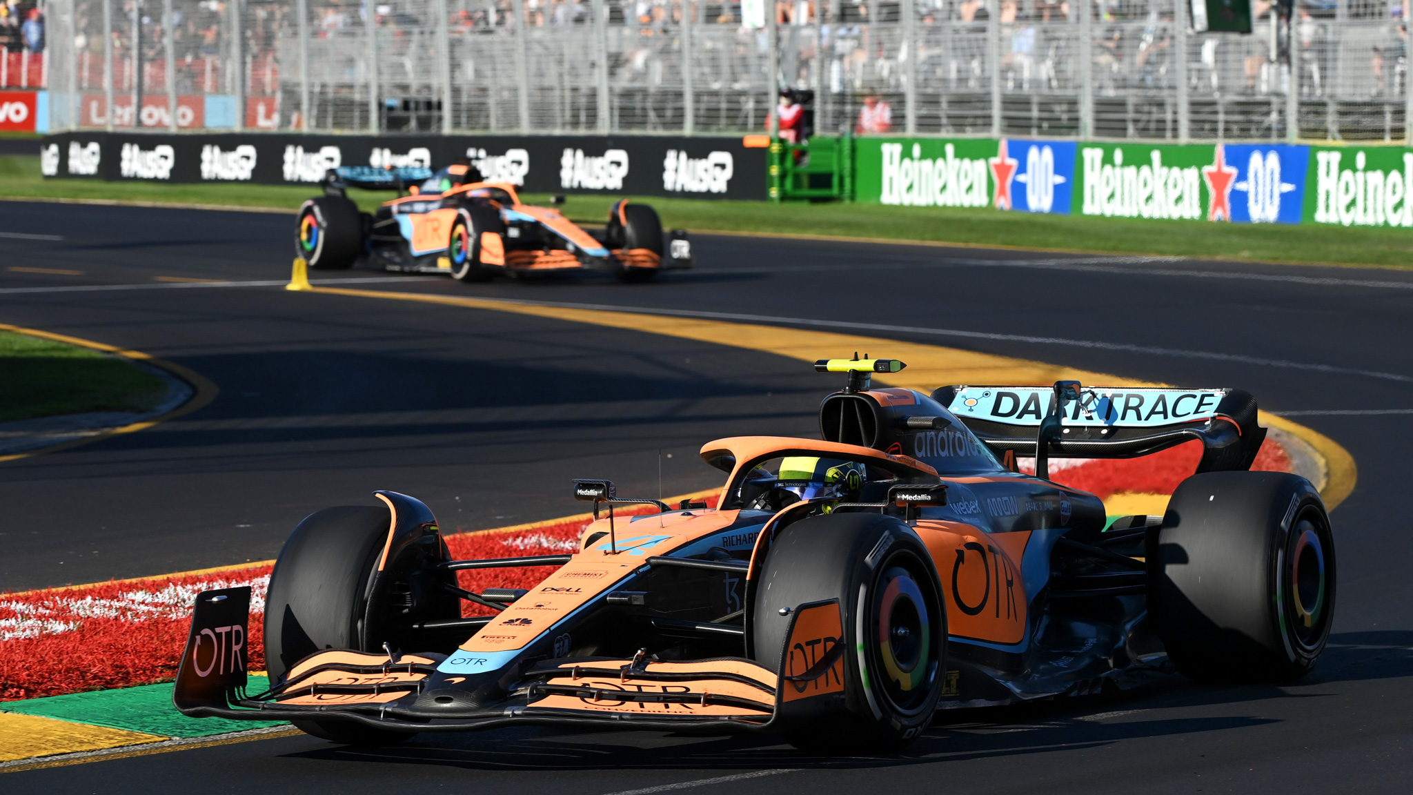 Lando Norris, McLaren MCL36, leads Daniel Ricciardo, McLaren MCL36