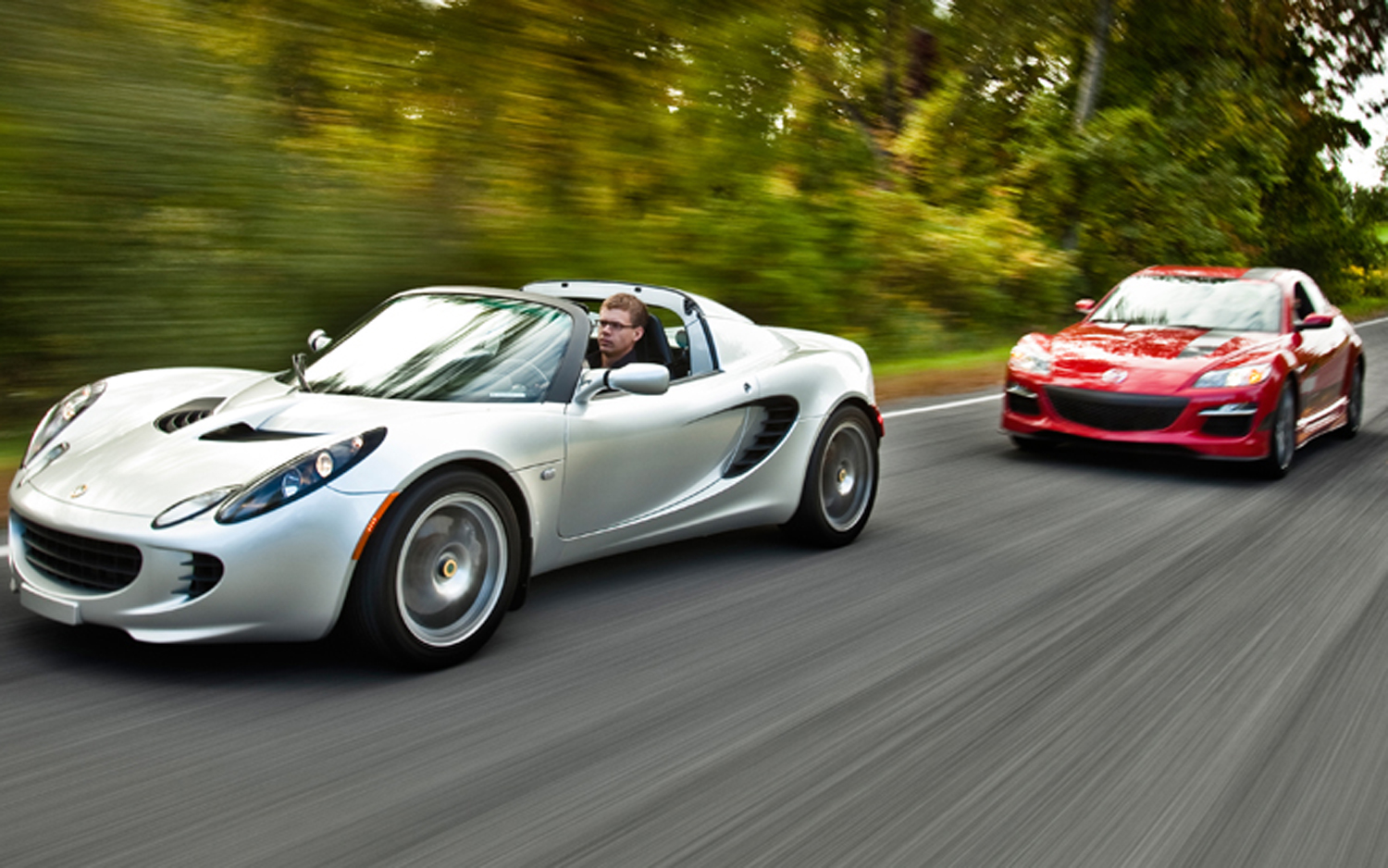 2012 lotus elise and 2012 mazda RX 8 front left side view