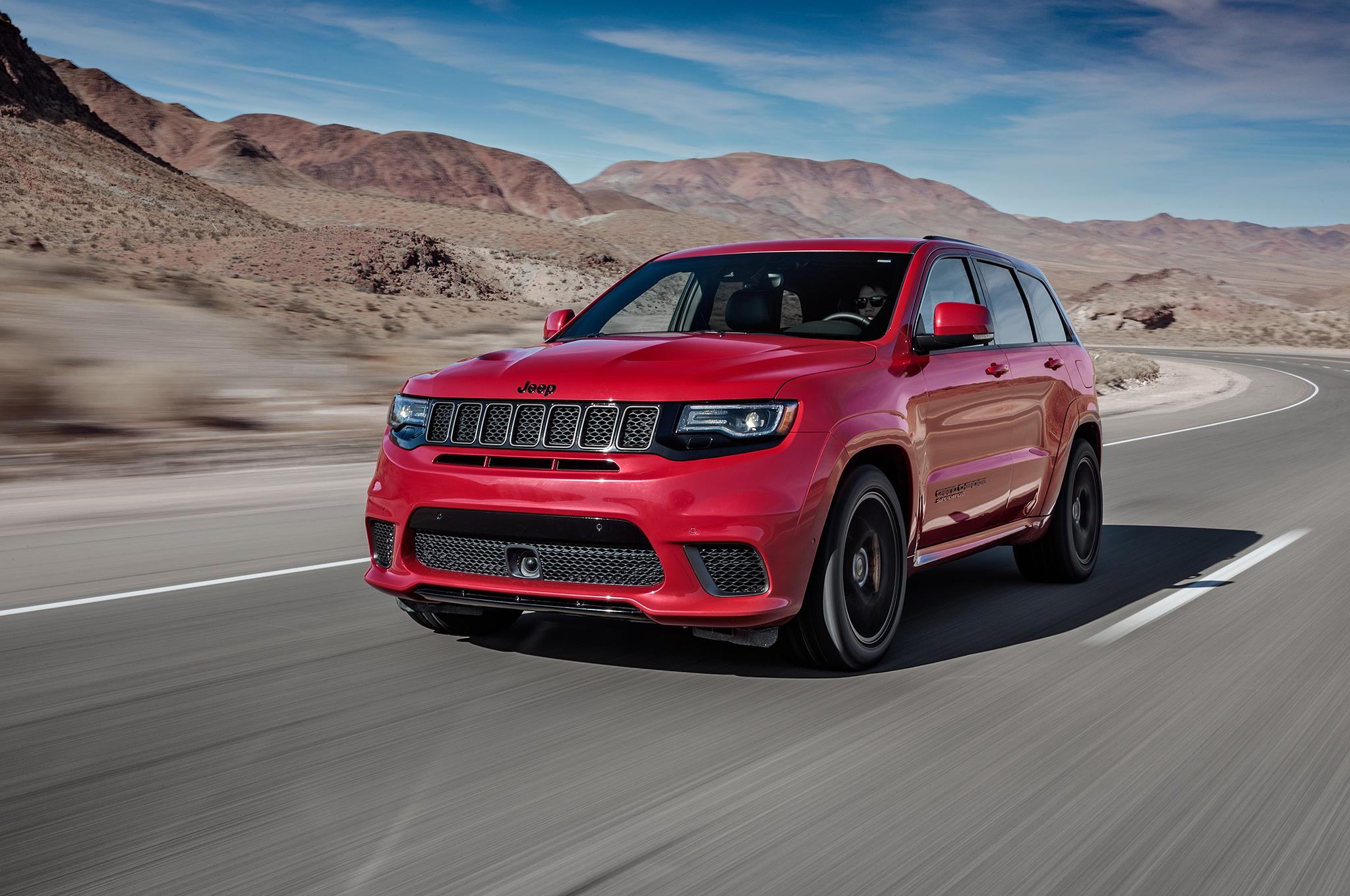 2018 Jeep Grand Cherokee Trackhawk front three quarter in motion 04