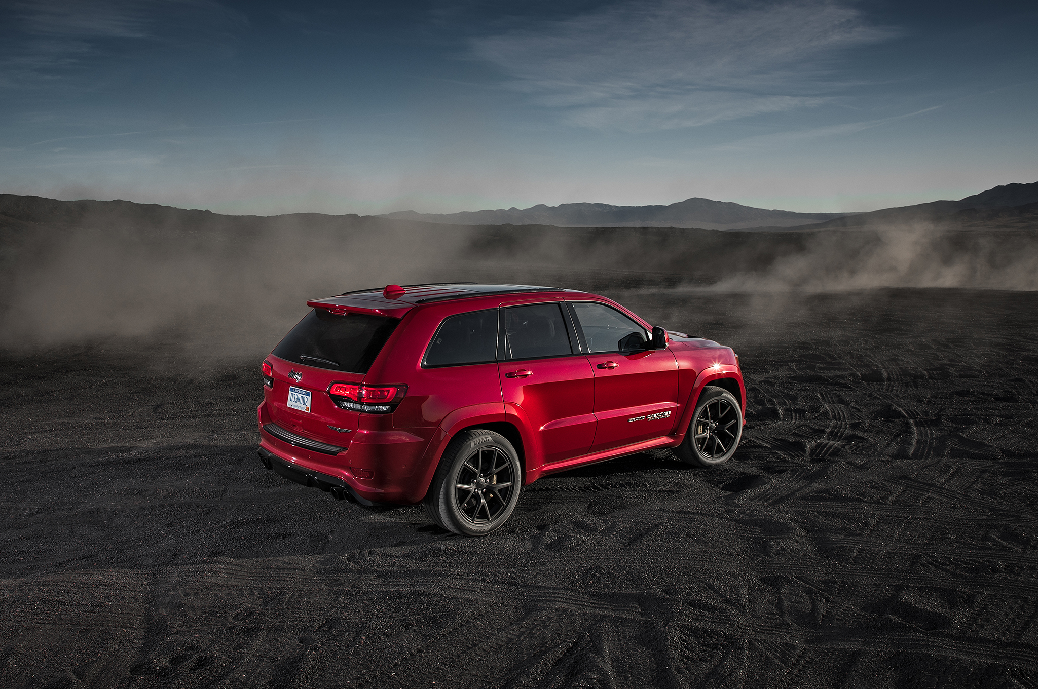 2018 Jeep Grand Cherokee Trackhawk rear three quarter 01