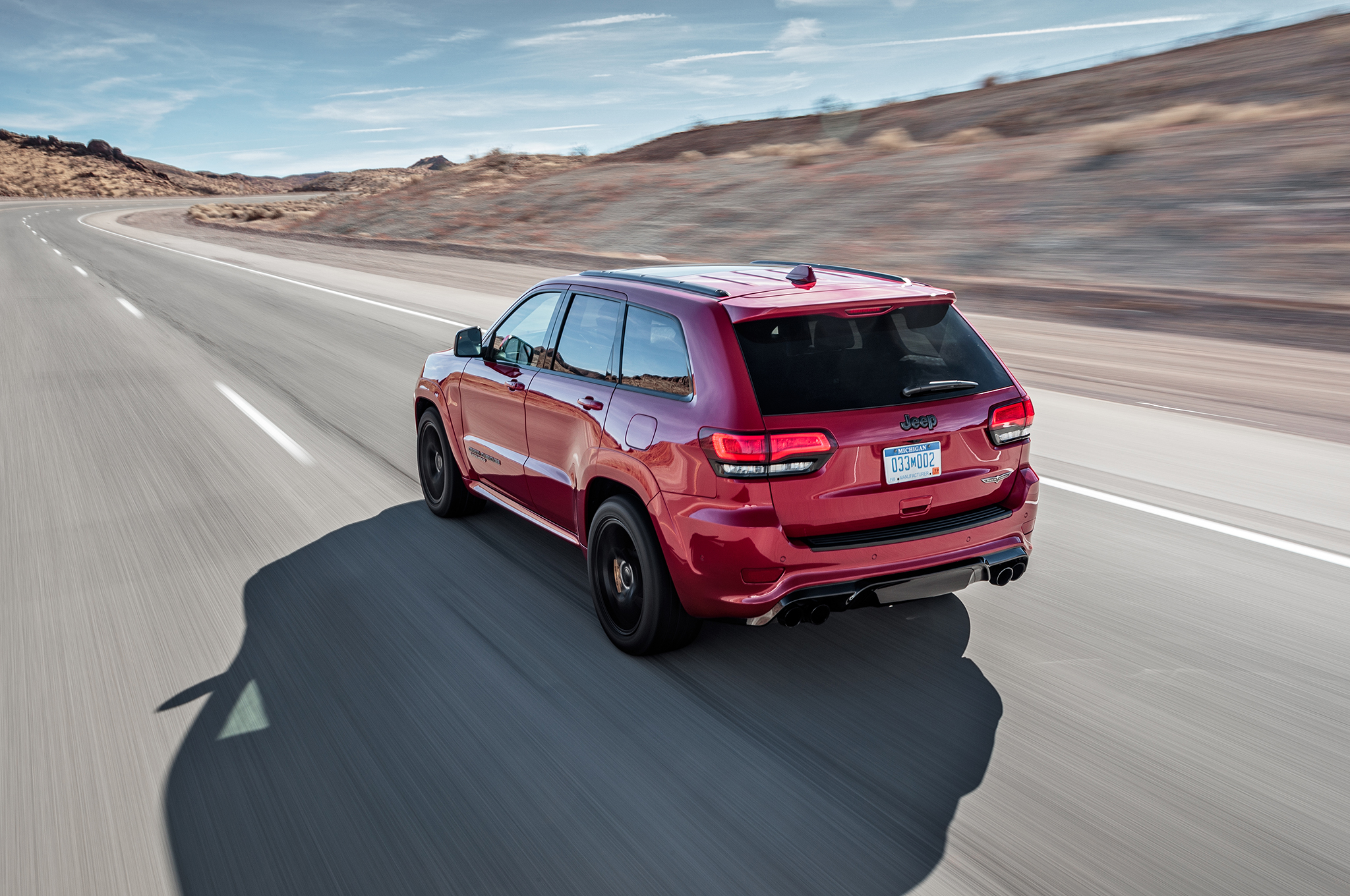2018 Jeep Grand Cherokee Trackhawk rear three quarter in motion