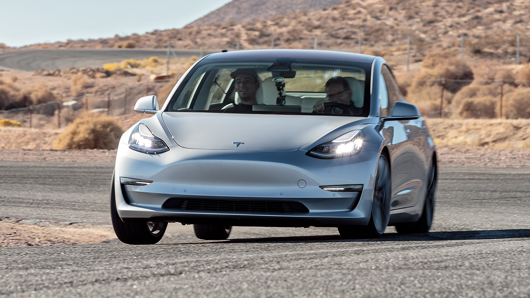 Tesla Model 3 Performance Track Mode front three quarter in motion 2