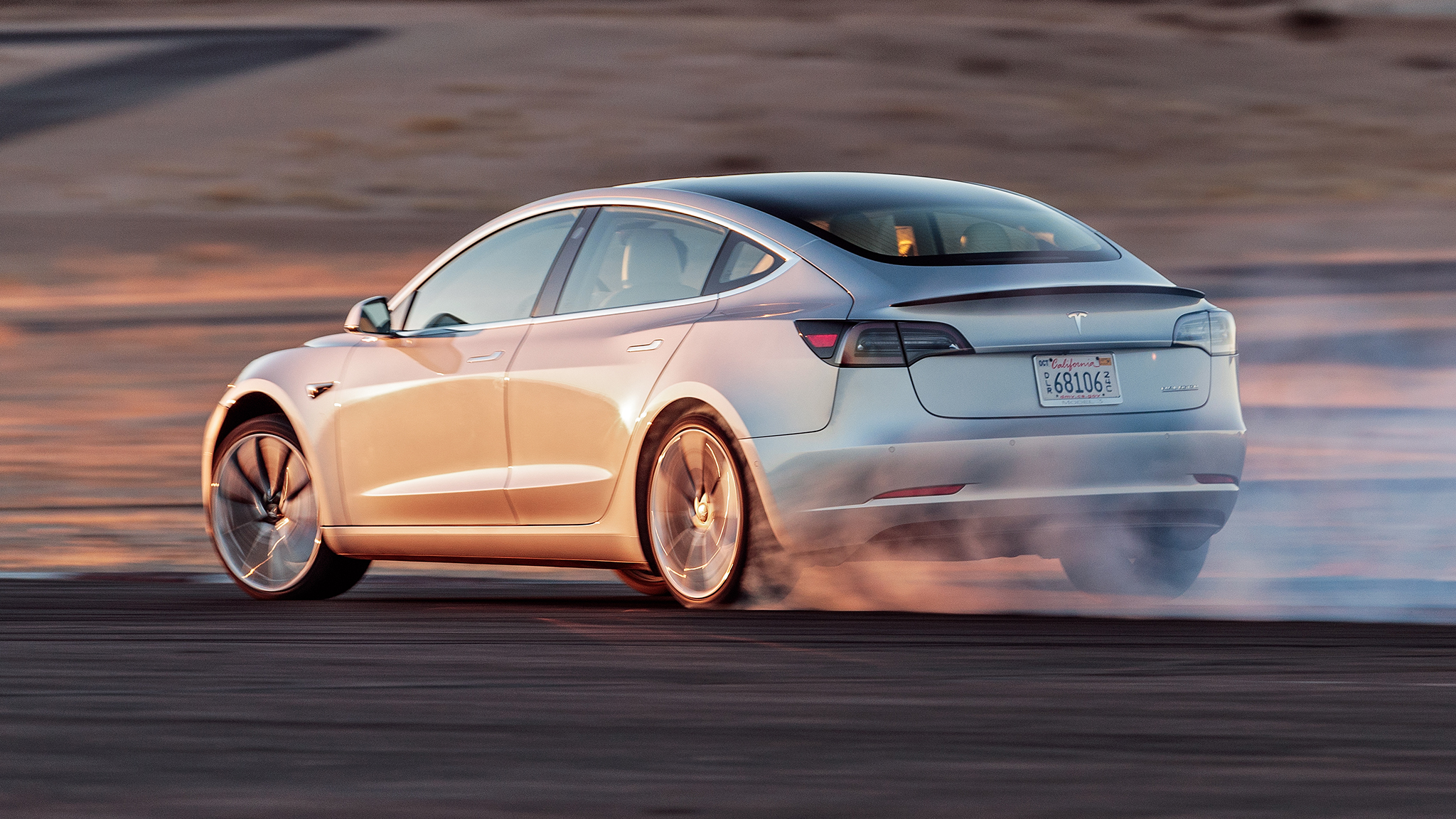 Tesla Model 3 Performance Track Mode rear three quarter in motion